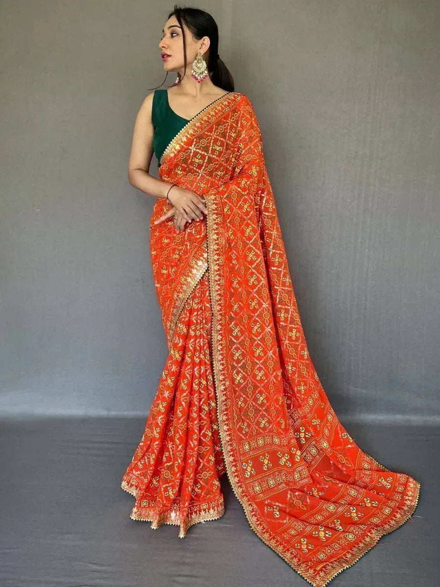 Orange embroidered saree with gold patterns and green blouse, Indian ethnic wear