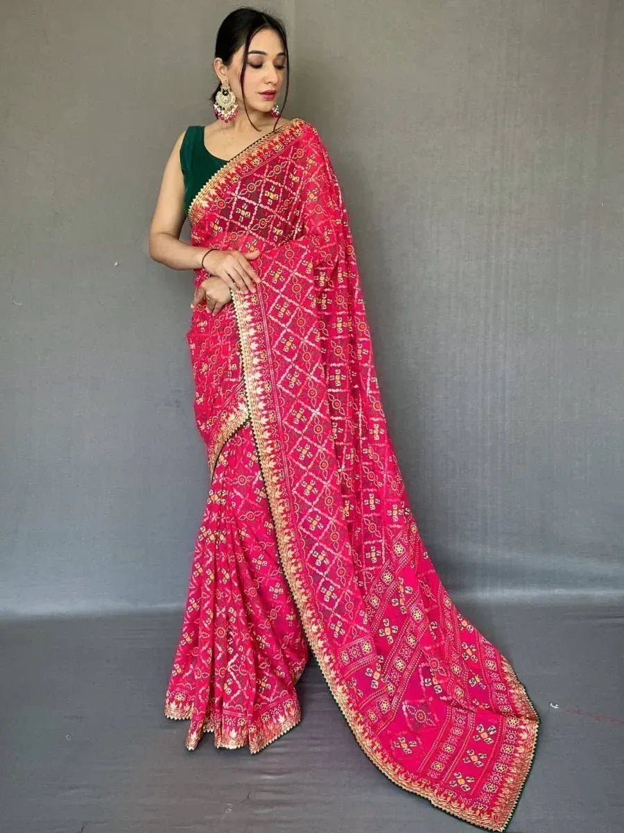 Pink embroidered saree with gold border, paired with green blouse, ethnic Indian wear