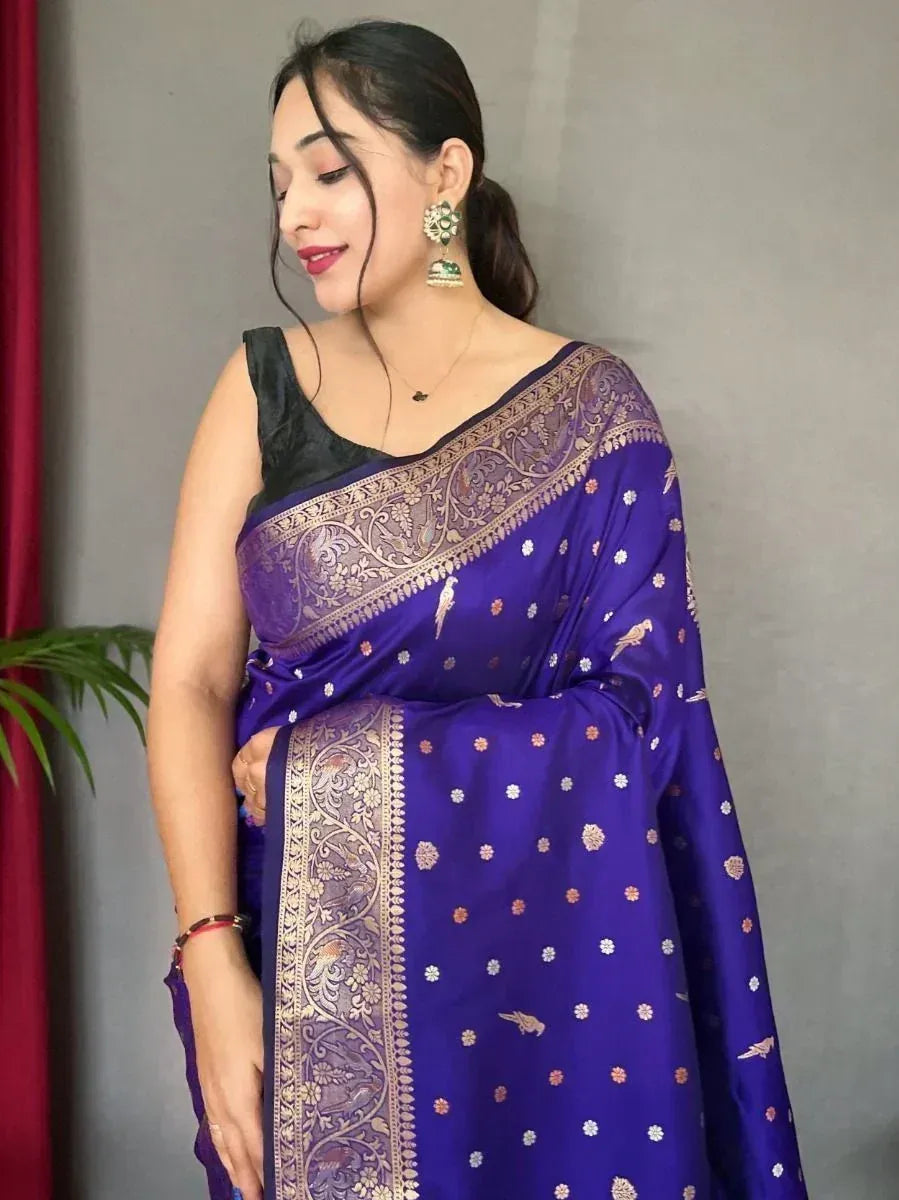 Royal purple saree with gold bird and floral motifs, paired with black blouse, perfect for ethnic occasions