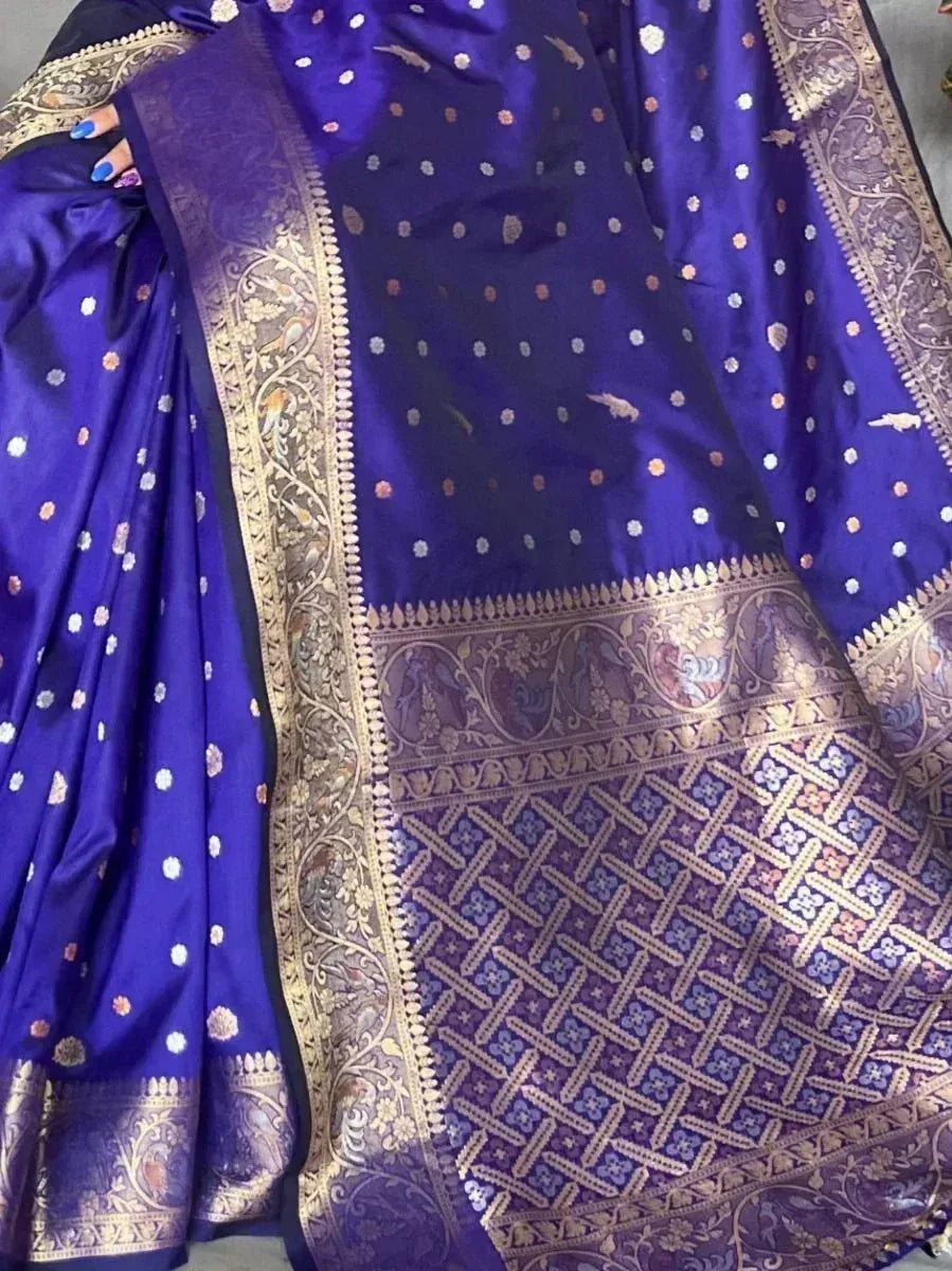 Royal blue ethnic saree with gold zari border and floral motifs, perfect for Indian occasions