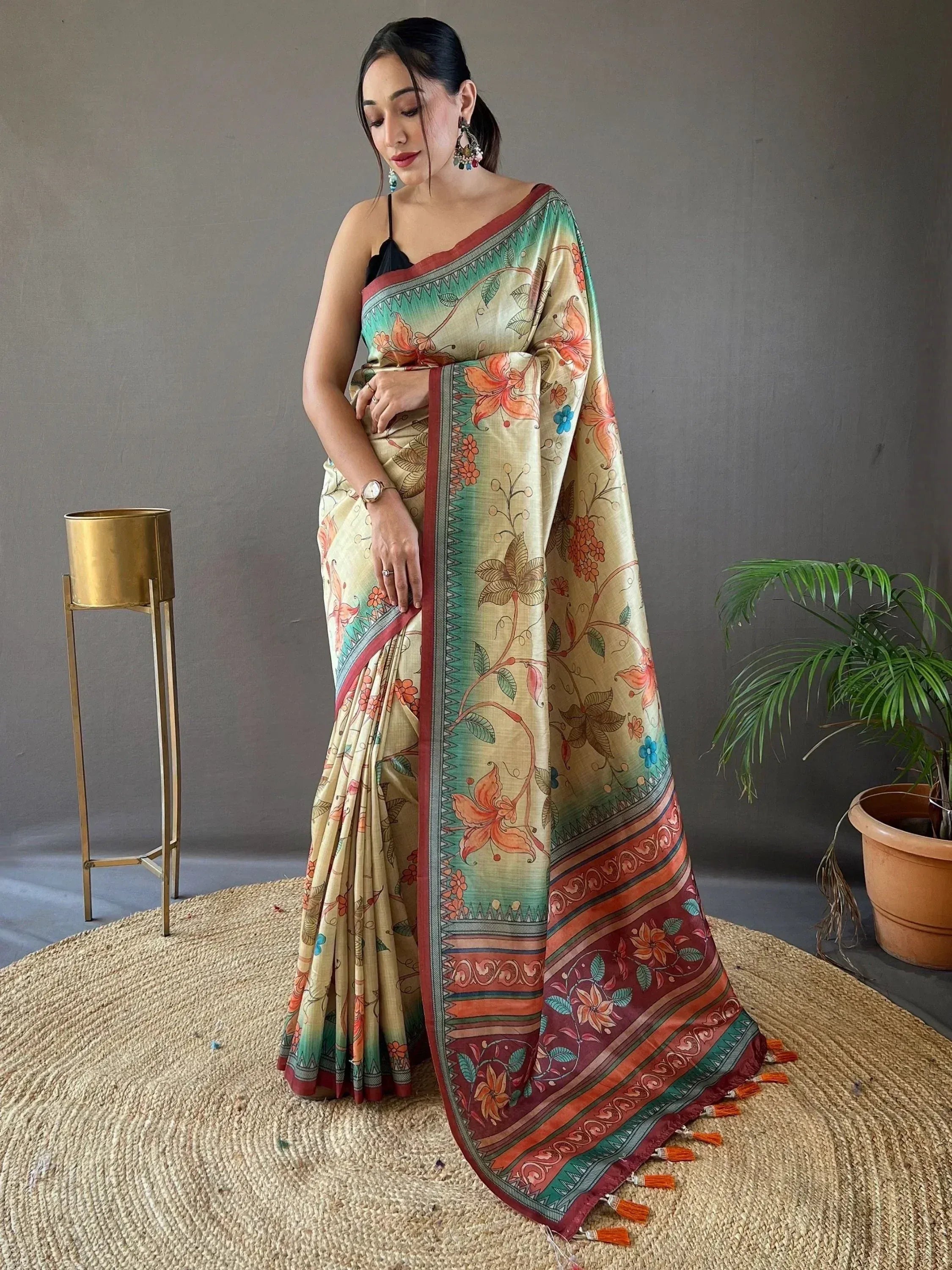 Woman in floral print ethnic saree with tassels, perfect for Indian occasions and festivals