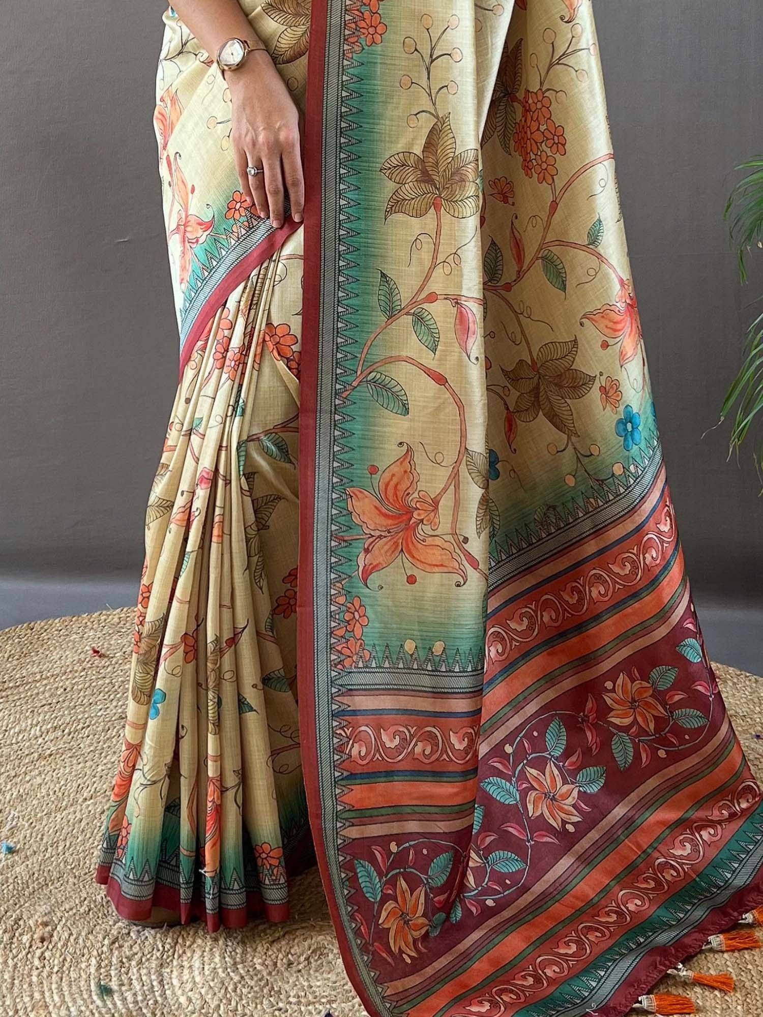 Floral printed ethnic saree with vibrant border and tassels, perfect for Indian occasions