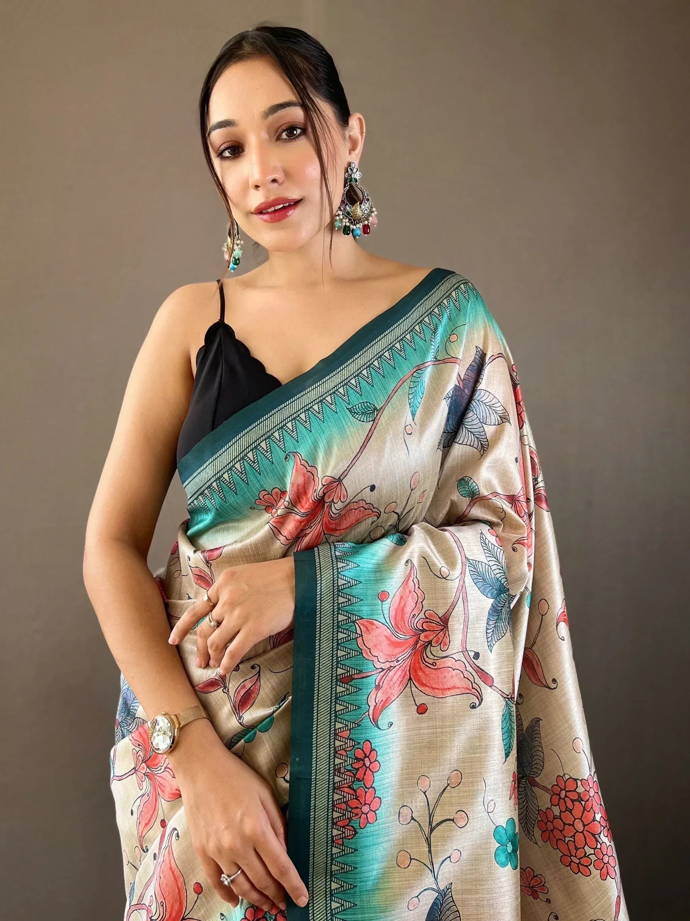 Woman in floral print saree with green border, ethnic Indian wear, designer saree style