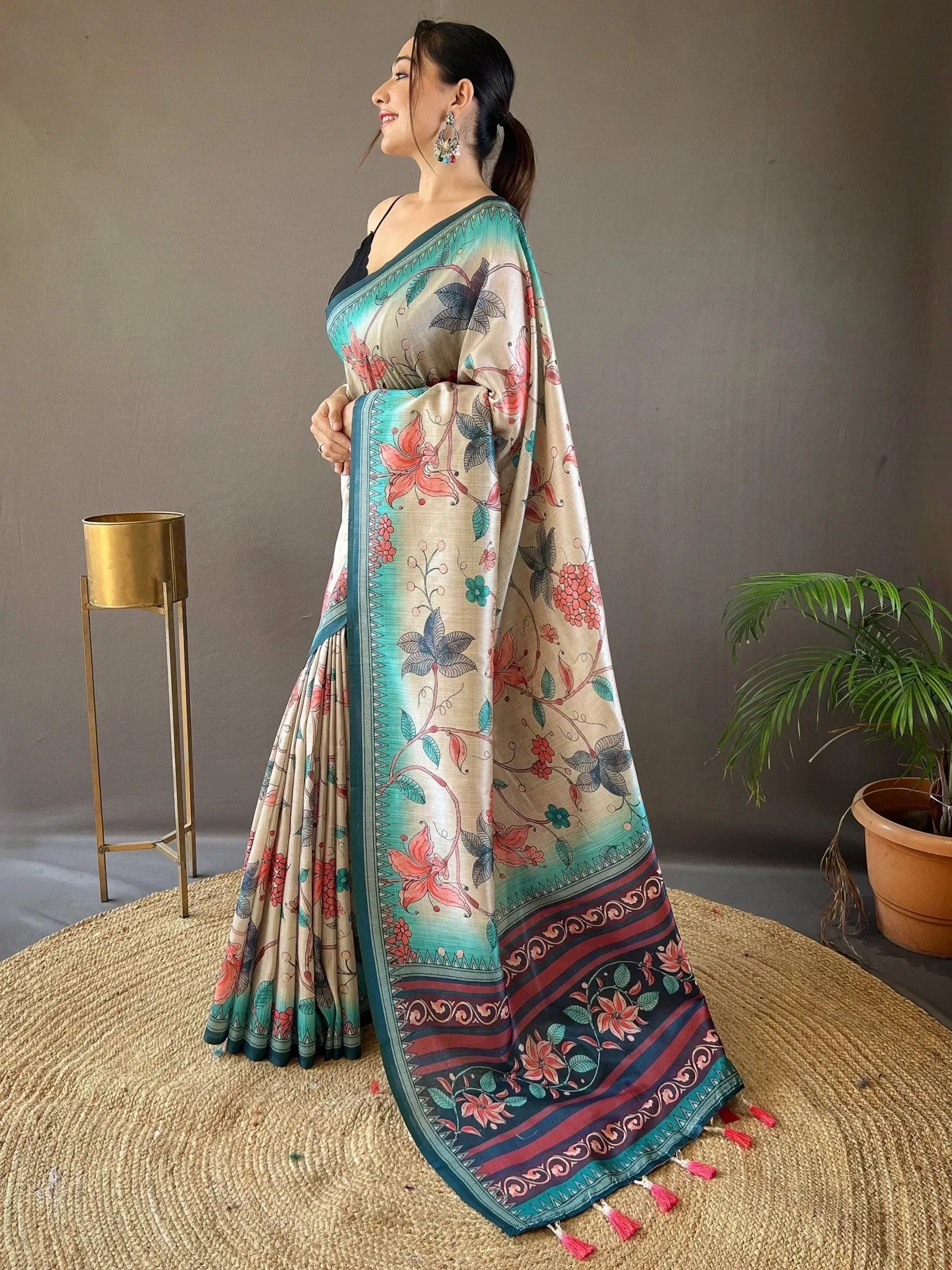 Floral print saree with teal border and tassels, ethnic Indian wear for women