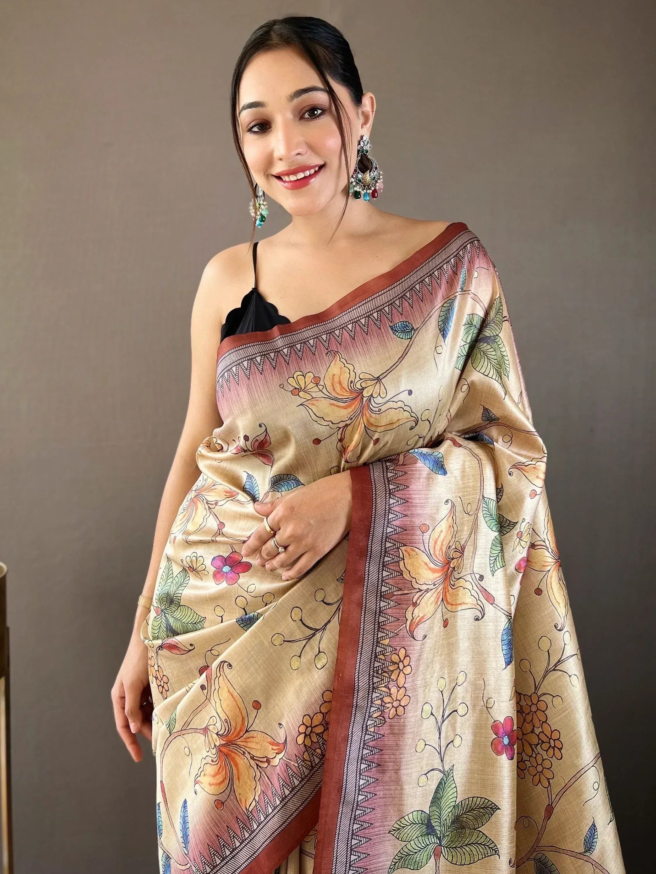Woman in elegant floral print saree with designer border, perfect for Indian ethnic wear occasions.