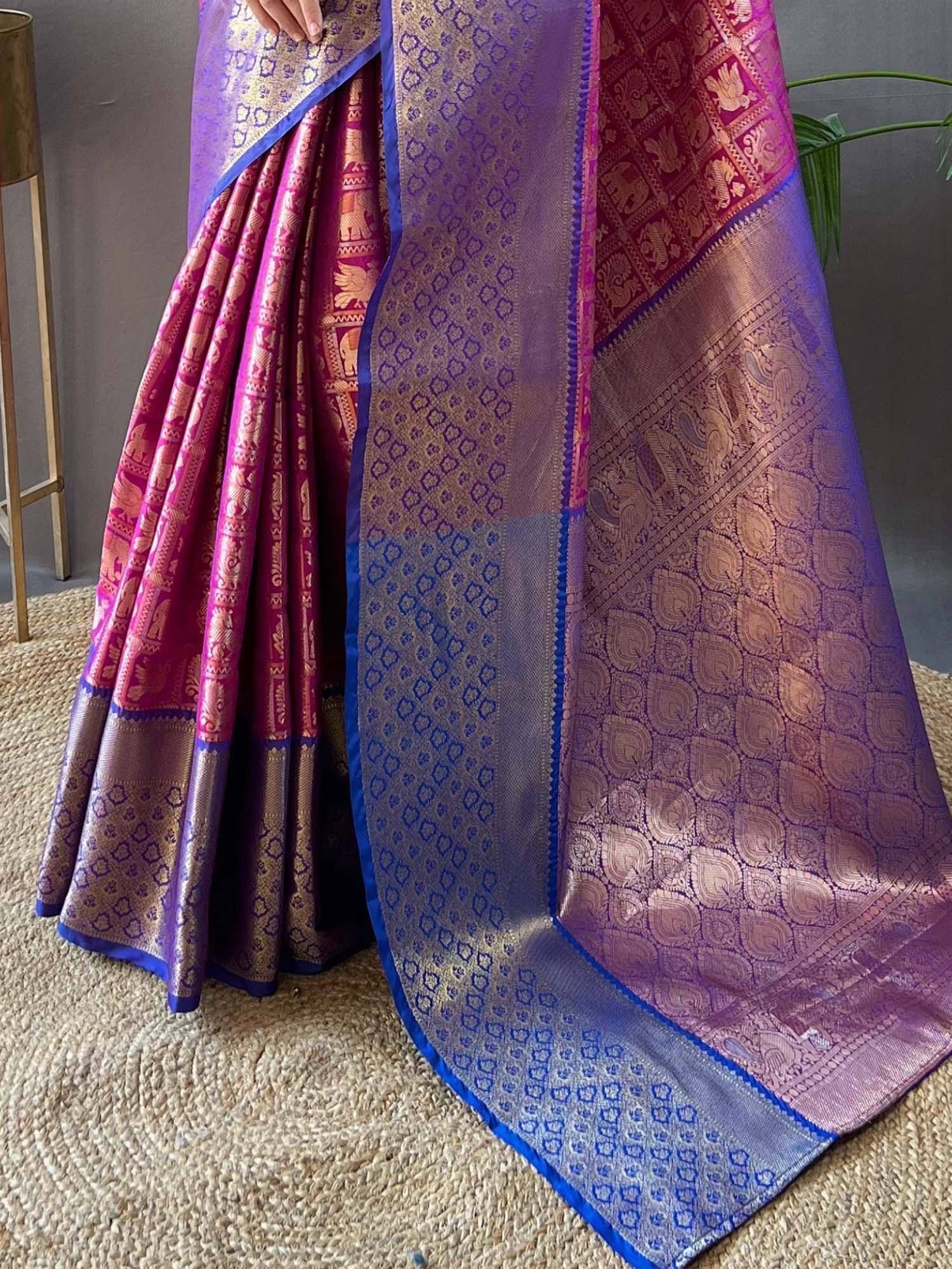 Purple and pink designer saree with elephant motifs and gold zari, perfect for Indian ethnic wear