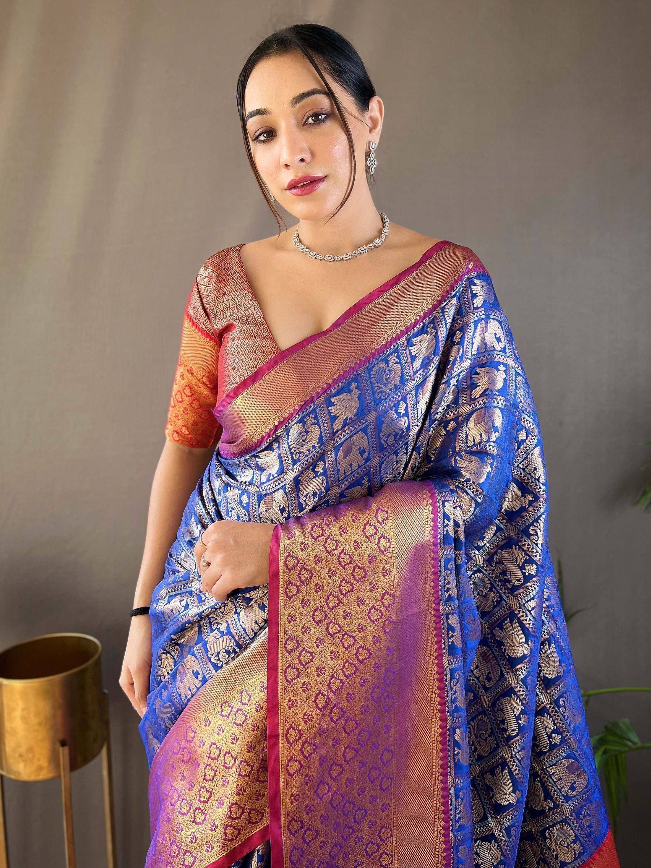Blue and gold designer saree with elephant motifs and intricate border, perfect for ethnic occasions