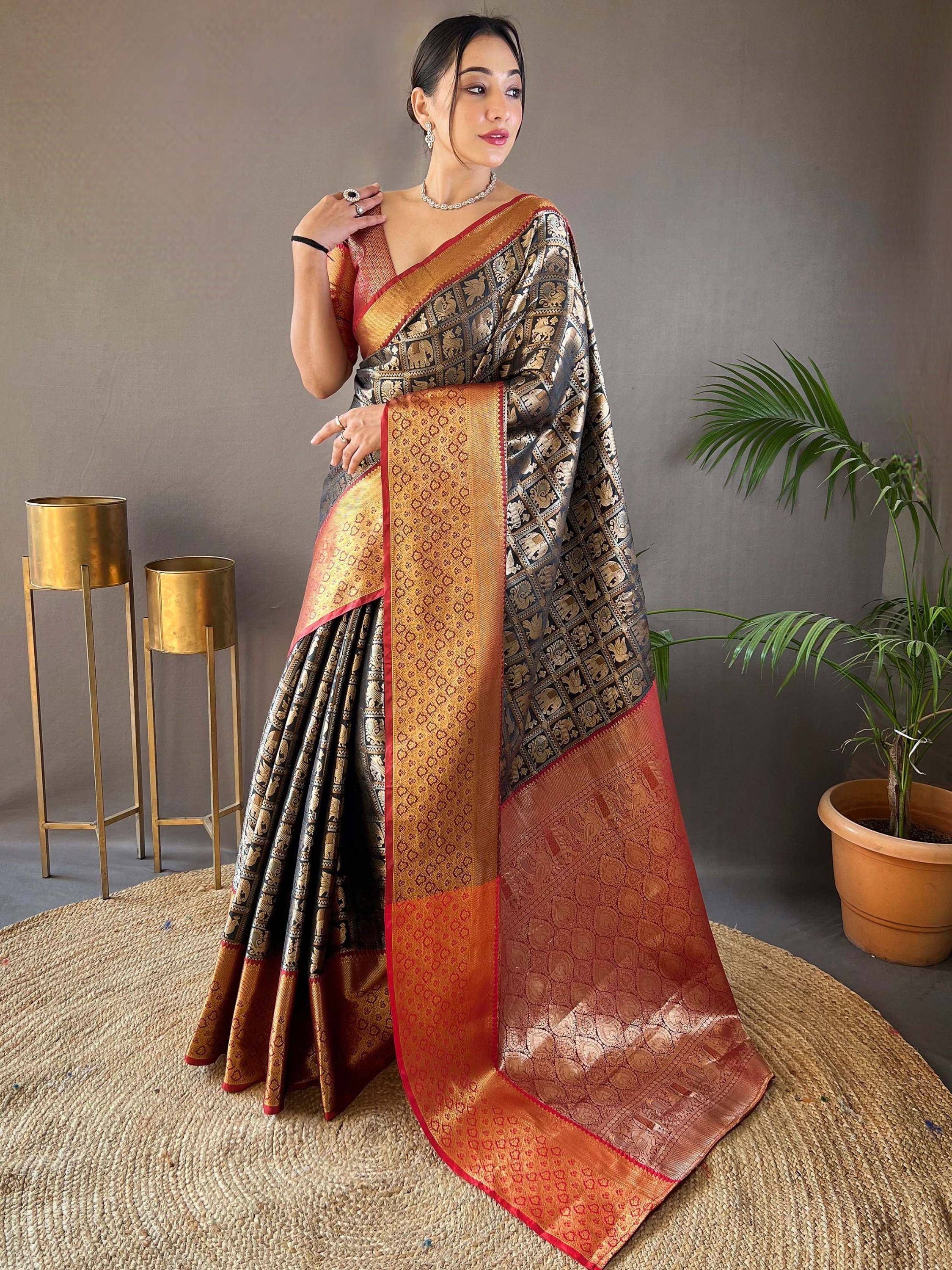 Elegant black and gold saree with intricate elephant motifs and rich border design