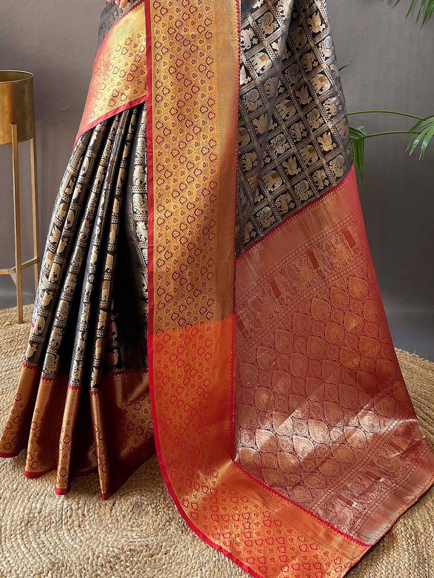 Elegant Indian saree with intricate gold and red patterns, perfect for ethnic wear