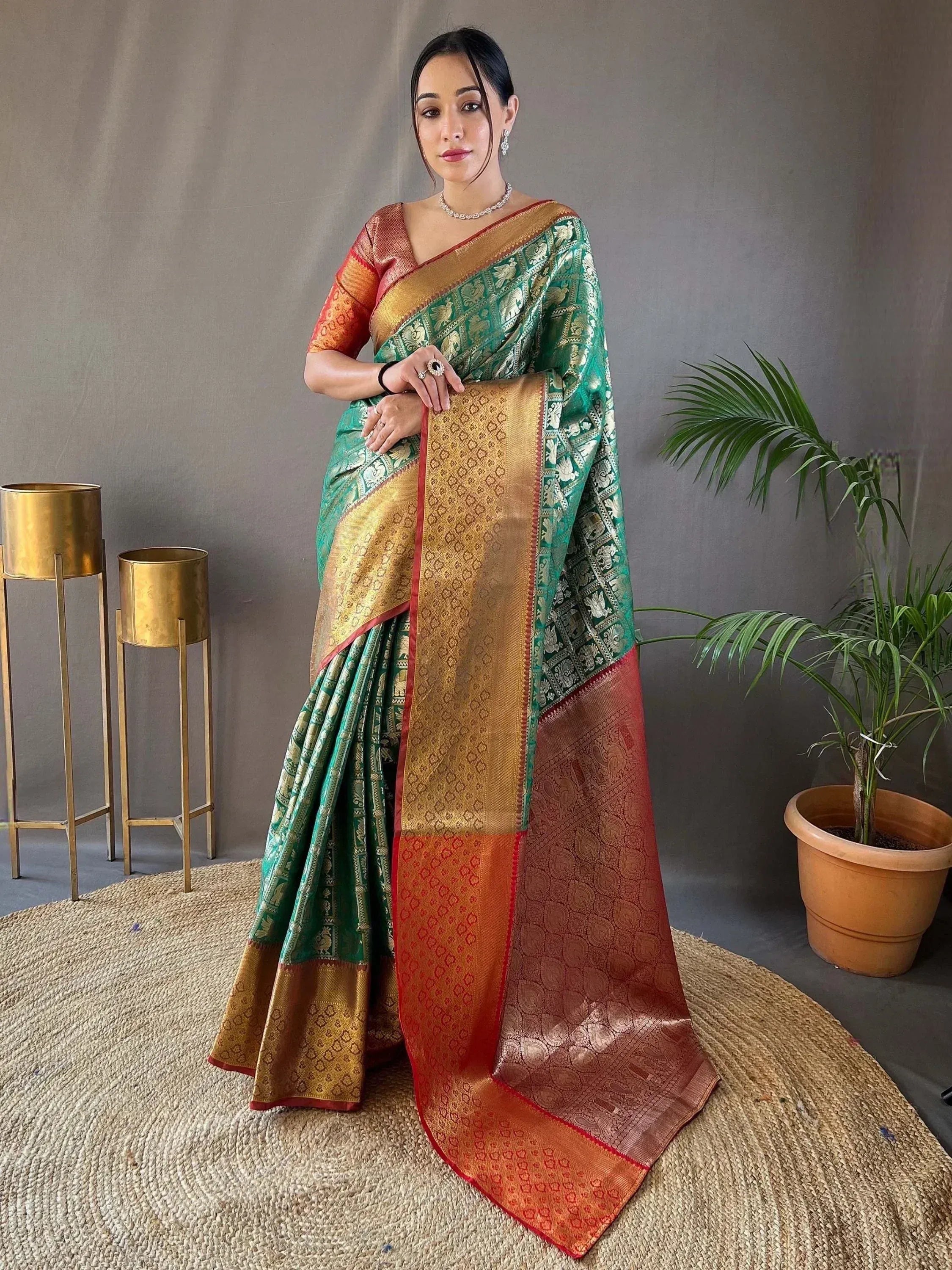 Elegant green and gold designer saree with intricate patterns, perfect for ethnic wear occasions.