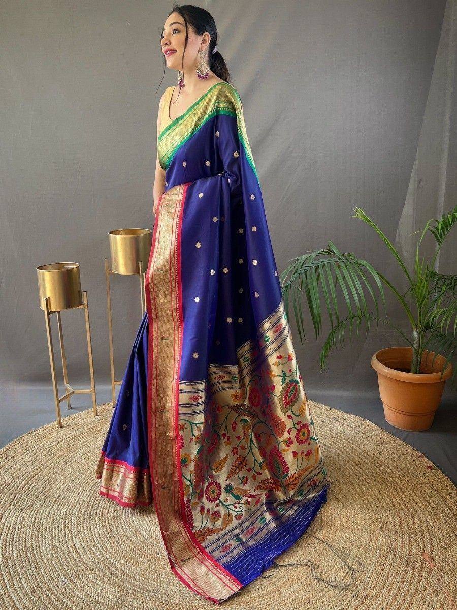 Woman in blue floral saree with gold border, ethnic Indian wear for festive occasions