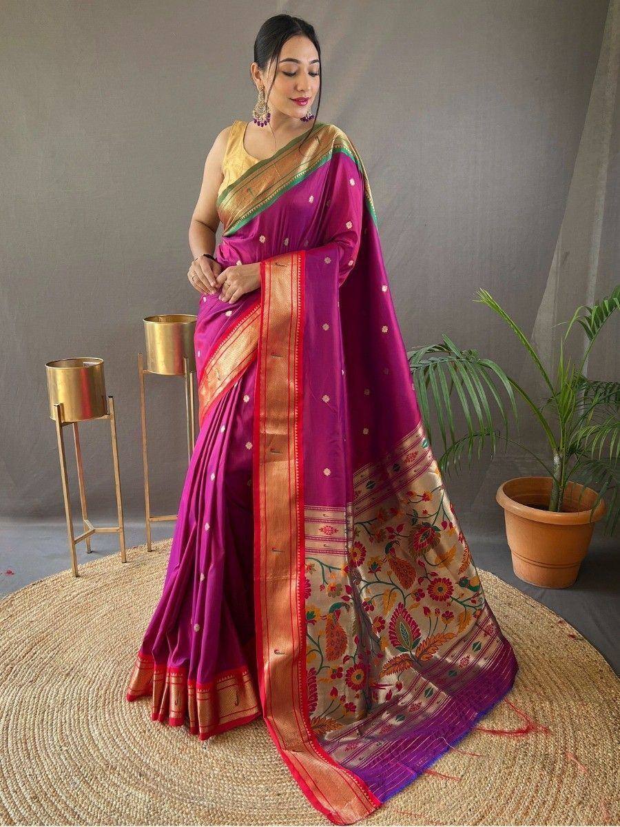 Vibrant purple designer saree with floral border and gold blouse, perfect for Indian ethnic occasions