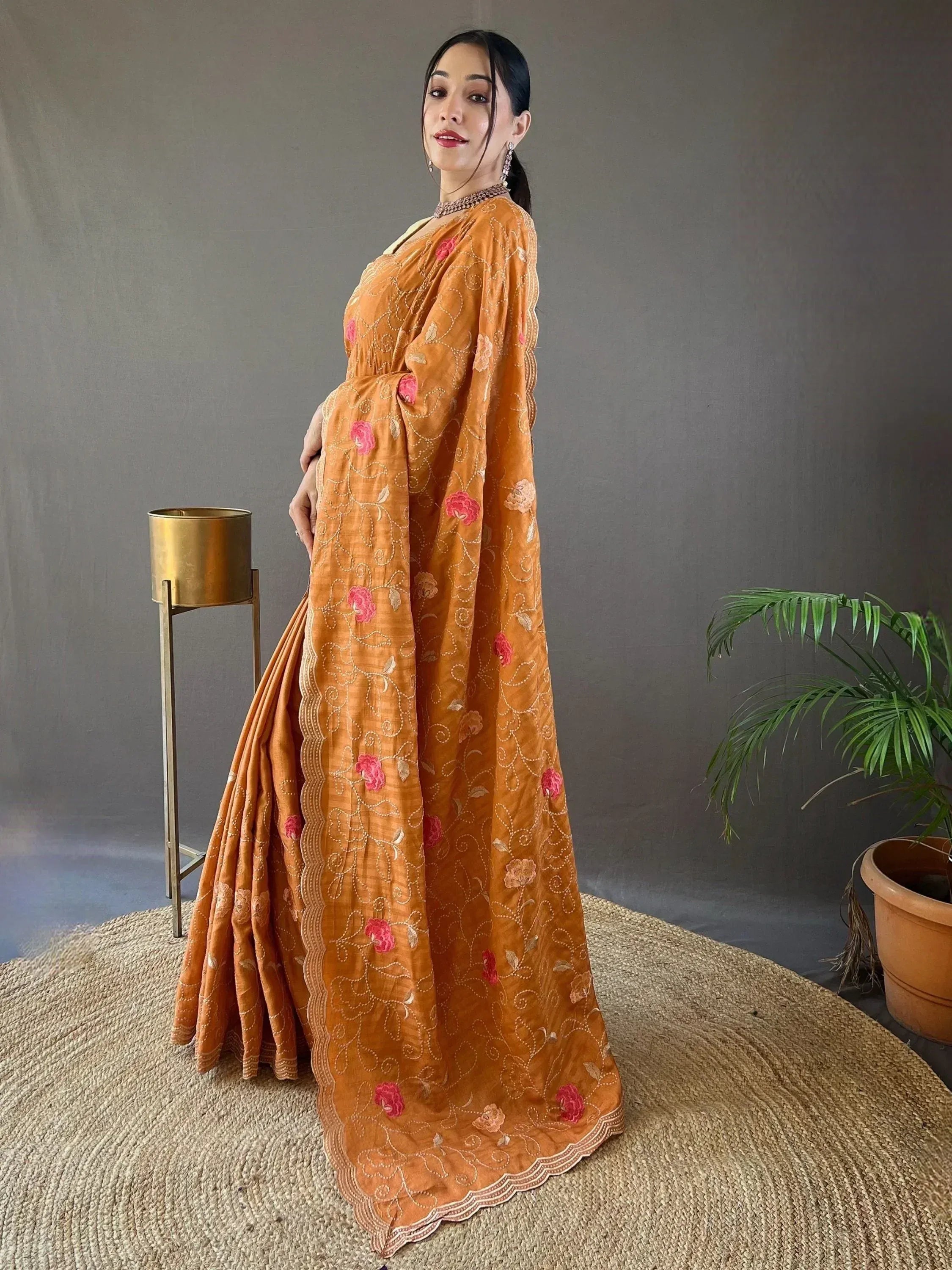 Mustard ethnic gown with pink floral embroidery, perfect for Indian occasions and festive wear.
