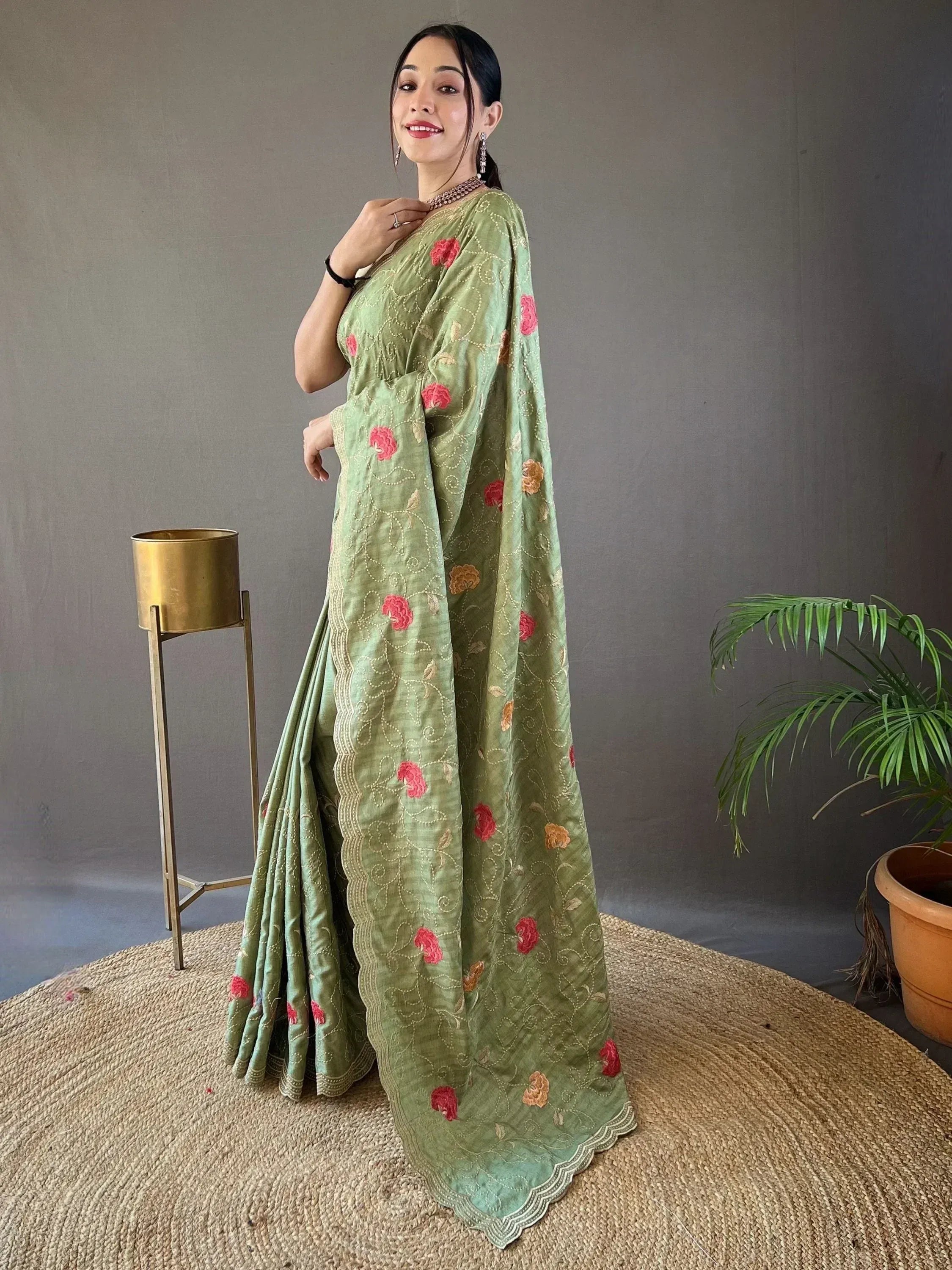 Green floral embroidered saree with pink blooms, perfect for Indian ethnic wear occasions