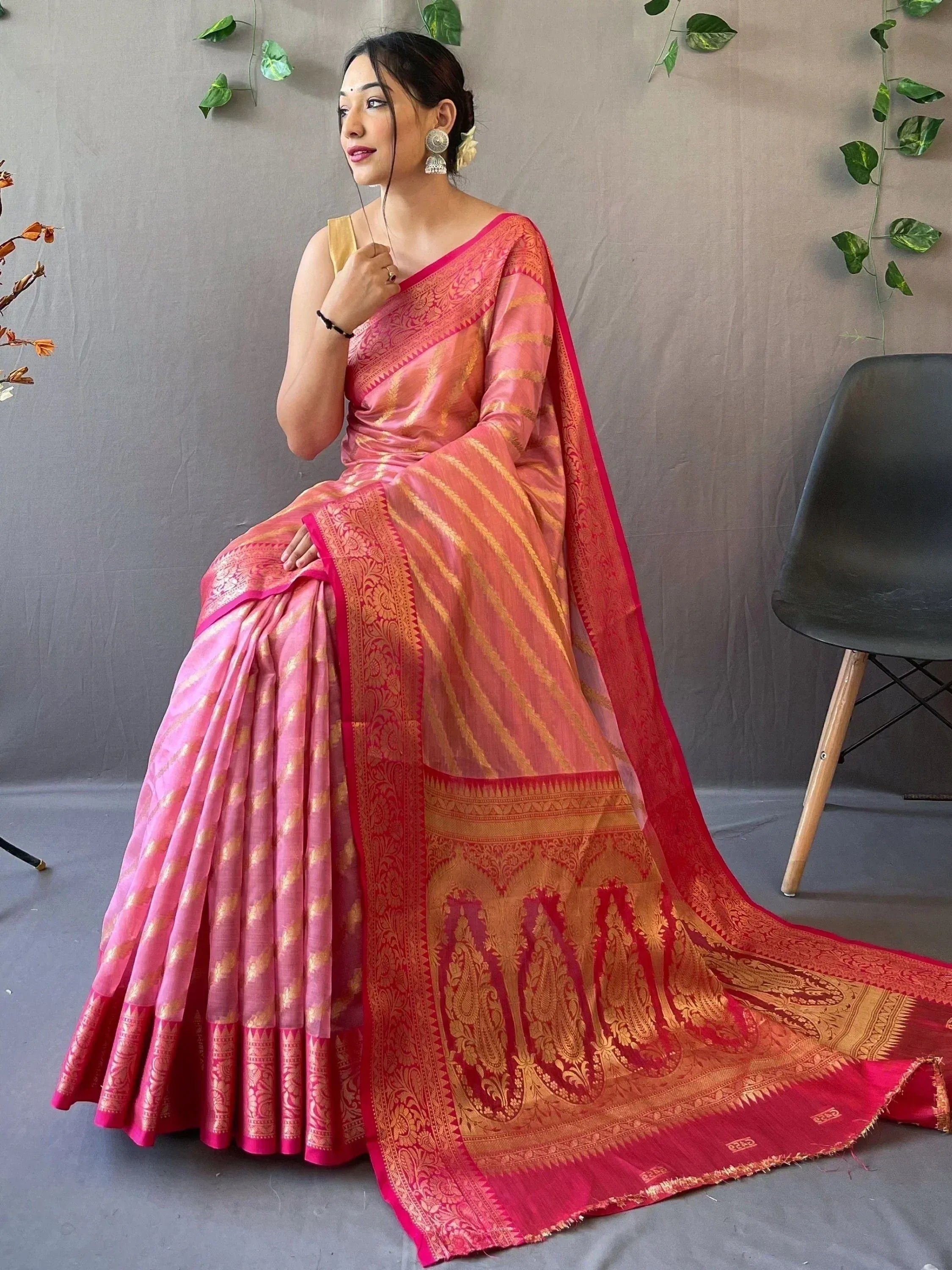 Pink and gold designer saree with intricate paisley border, perfect for Indian ethnic wear occasions
