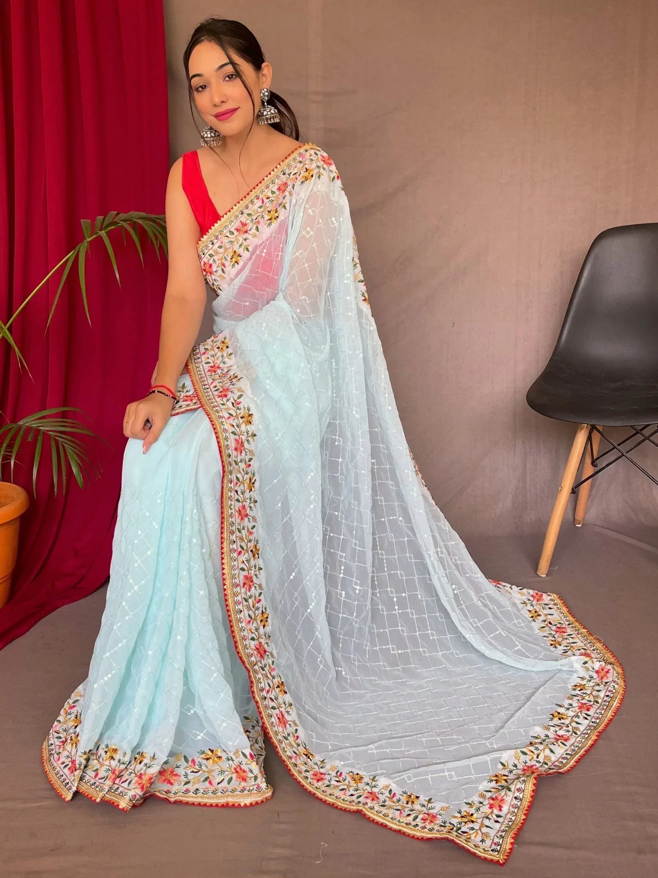 Light blue embroidered saree with floral border and red blouse, Indian ethnic wear