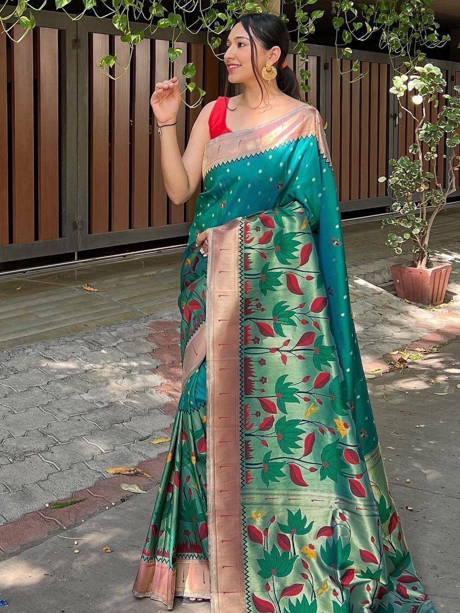 Woman in green floral print saree with red blouse, ethnic Indian wear for festive occasions