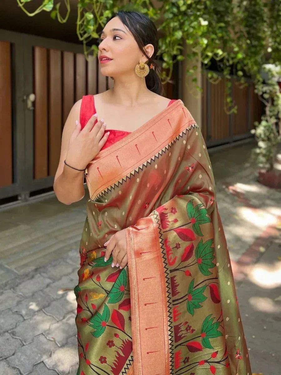 Woman in olive green floral saree with red blouse, perfect for Indian ethnic wear occasions
