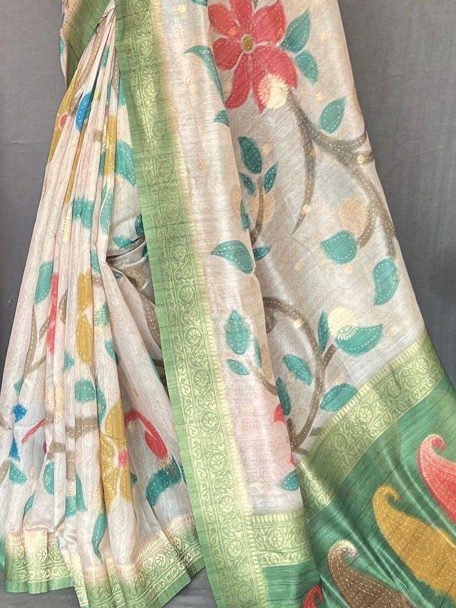Cream floral saree with green border, peacock motifs, and gold zari work — Indian ethnic wear