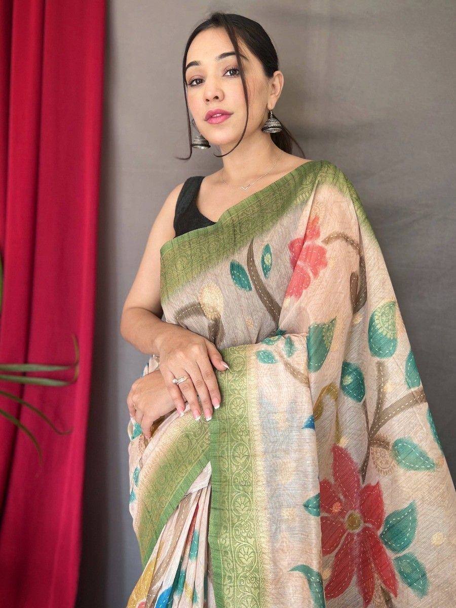Woman in floral printed saree with green border, ethnic Indian wear