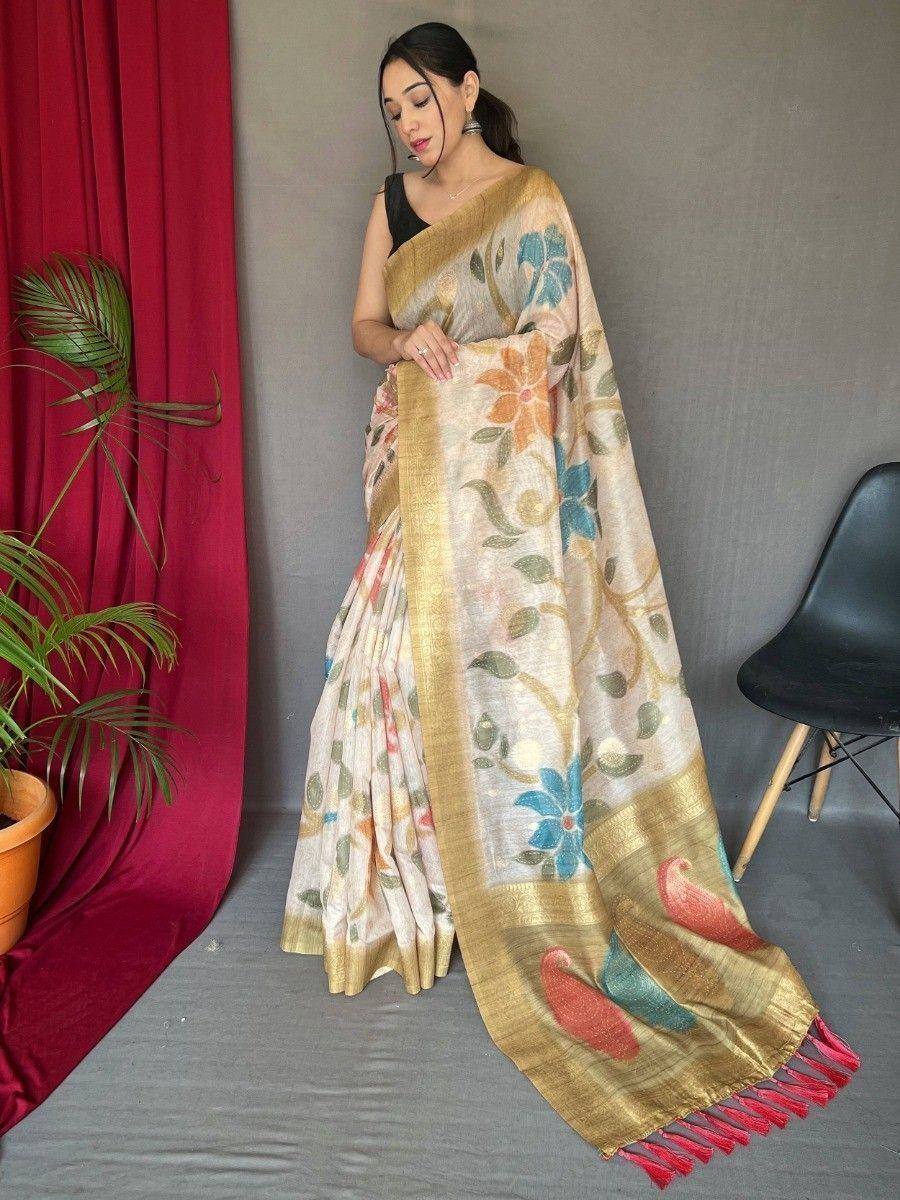 Floral print saree with golden border and peacock motifs, perfect for ethnic occasions