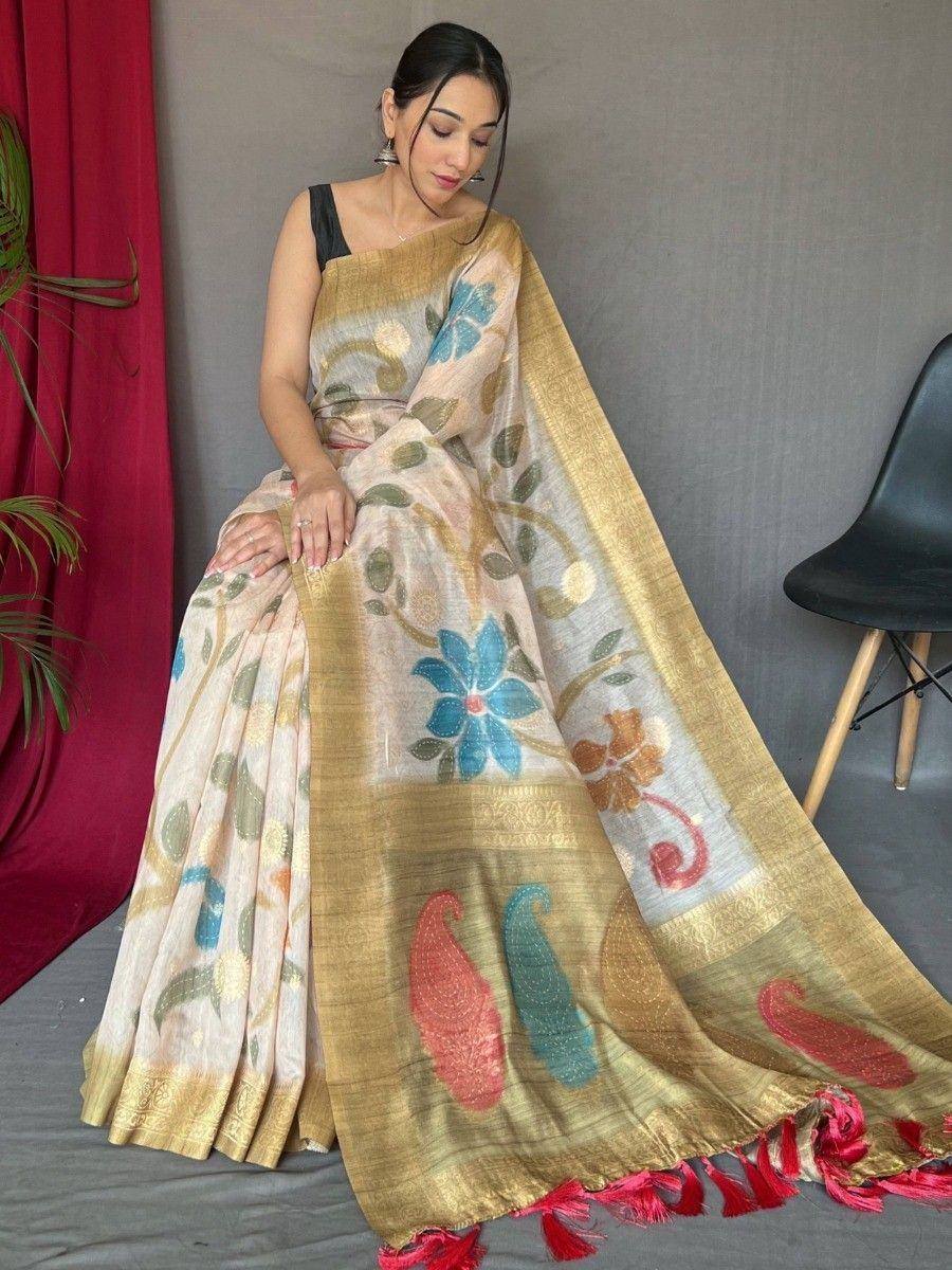 Floral printed ethnic saree with gold border and red tassels, paired with black blouse