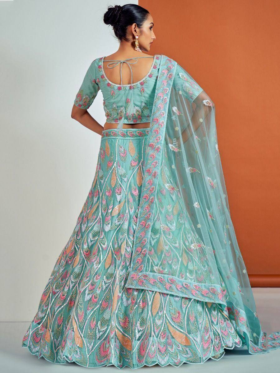 Mint green designer lehenga choli with floral embroidery and sheer dupatta, perfect for Indian ethnic occasions.