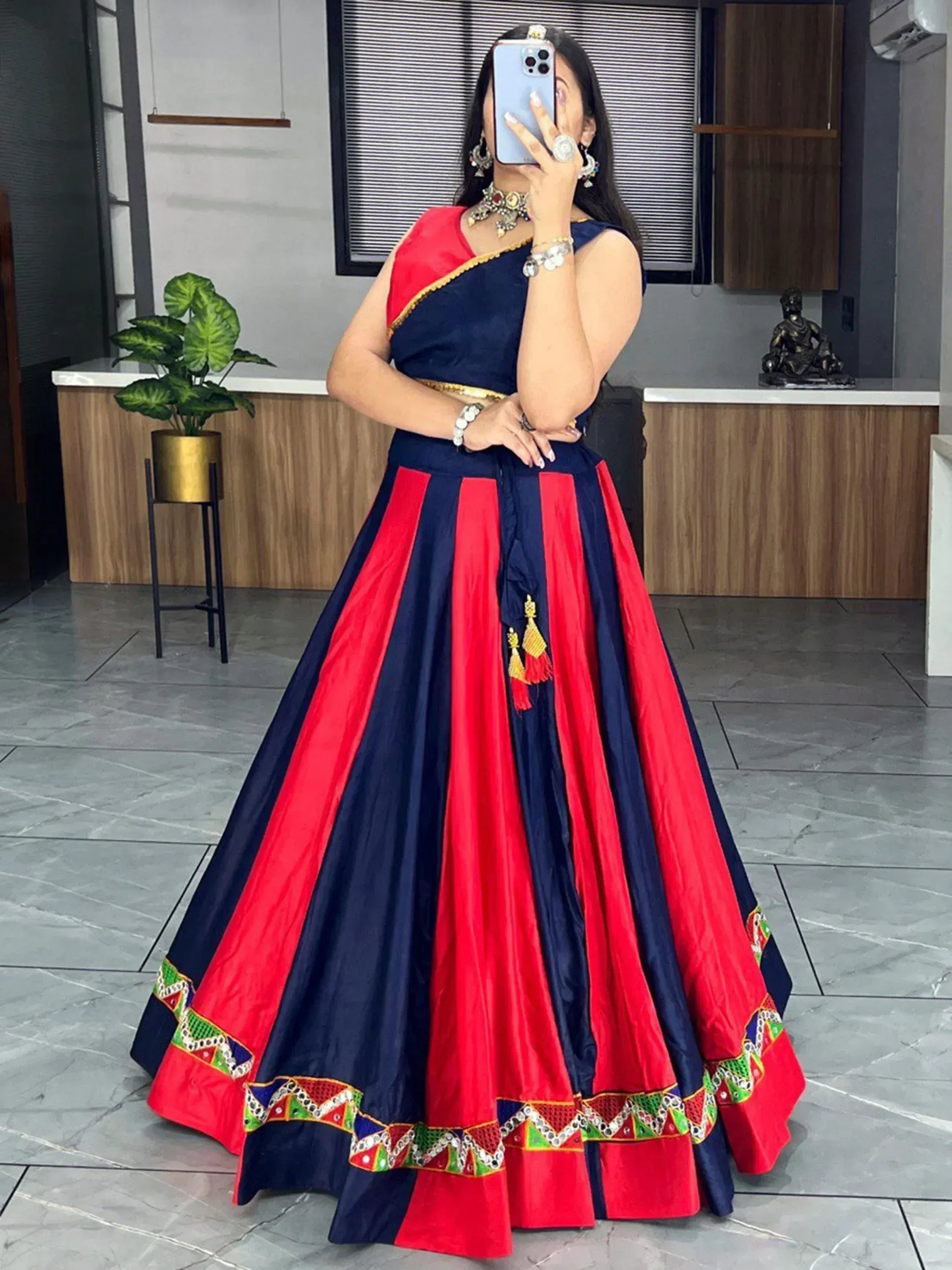 Red and navy blue designer lehenga choli with mirror work and tassels, ethnic Indian wear