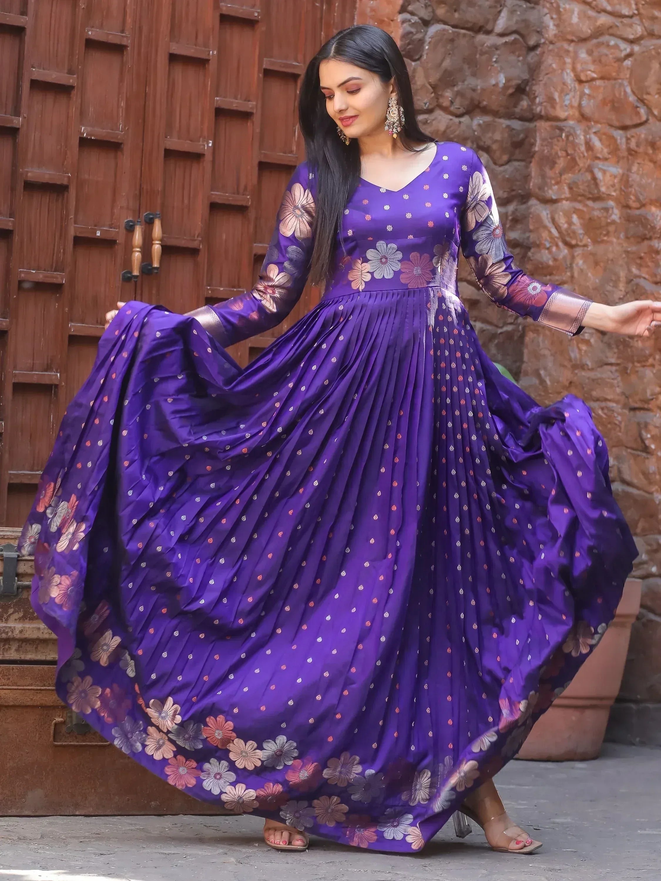 Purple floral ethnic gown with pleated skirt, perfect for Indian occasions and festive wear.