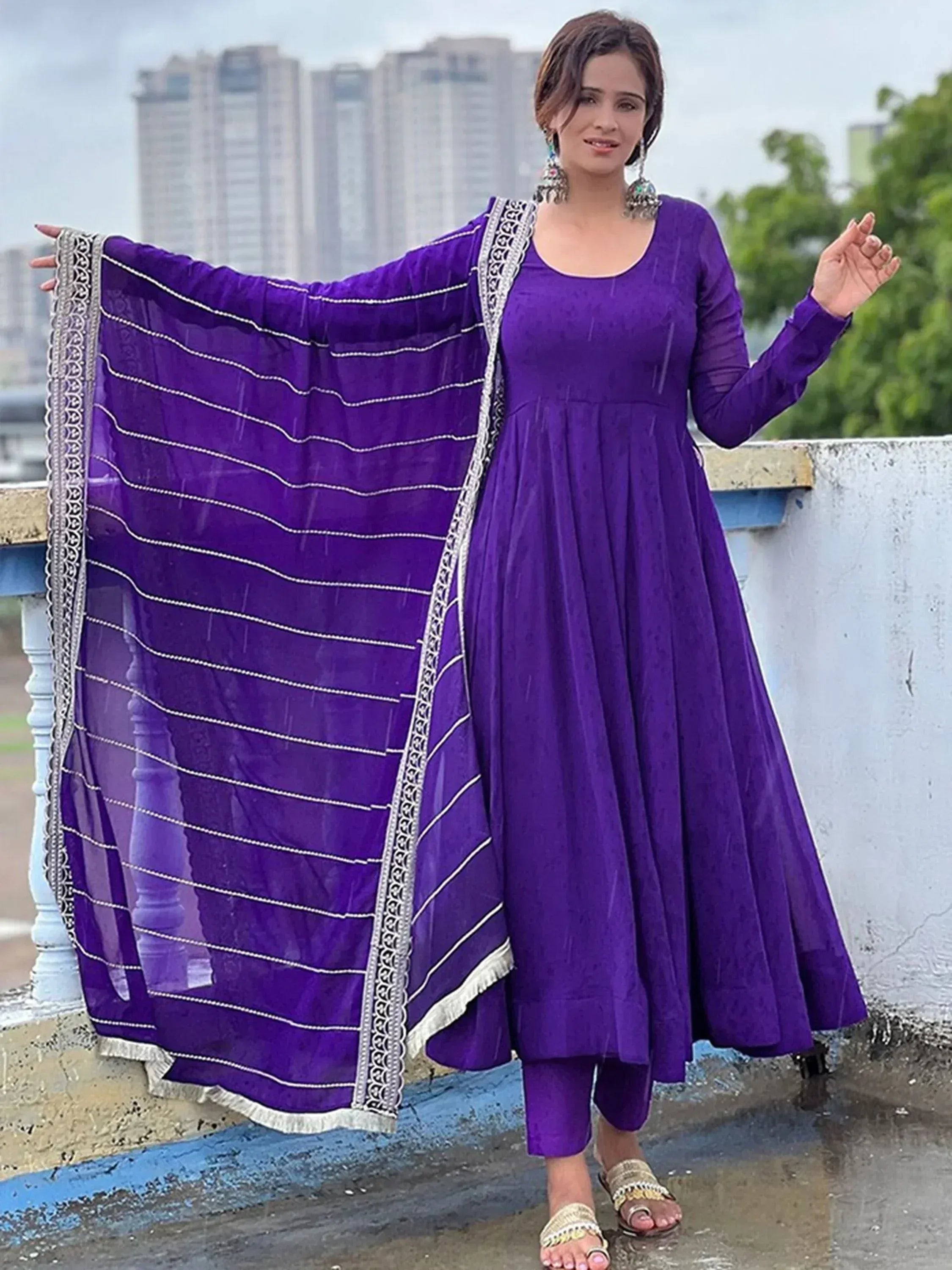 Purple ethnic anarkali suit with embroidered dupatta, perfect for Indian occasions and festive wear.