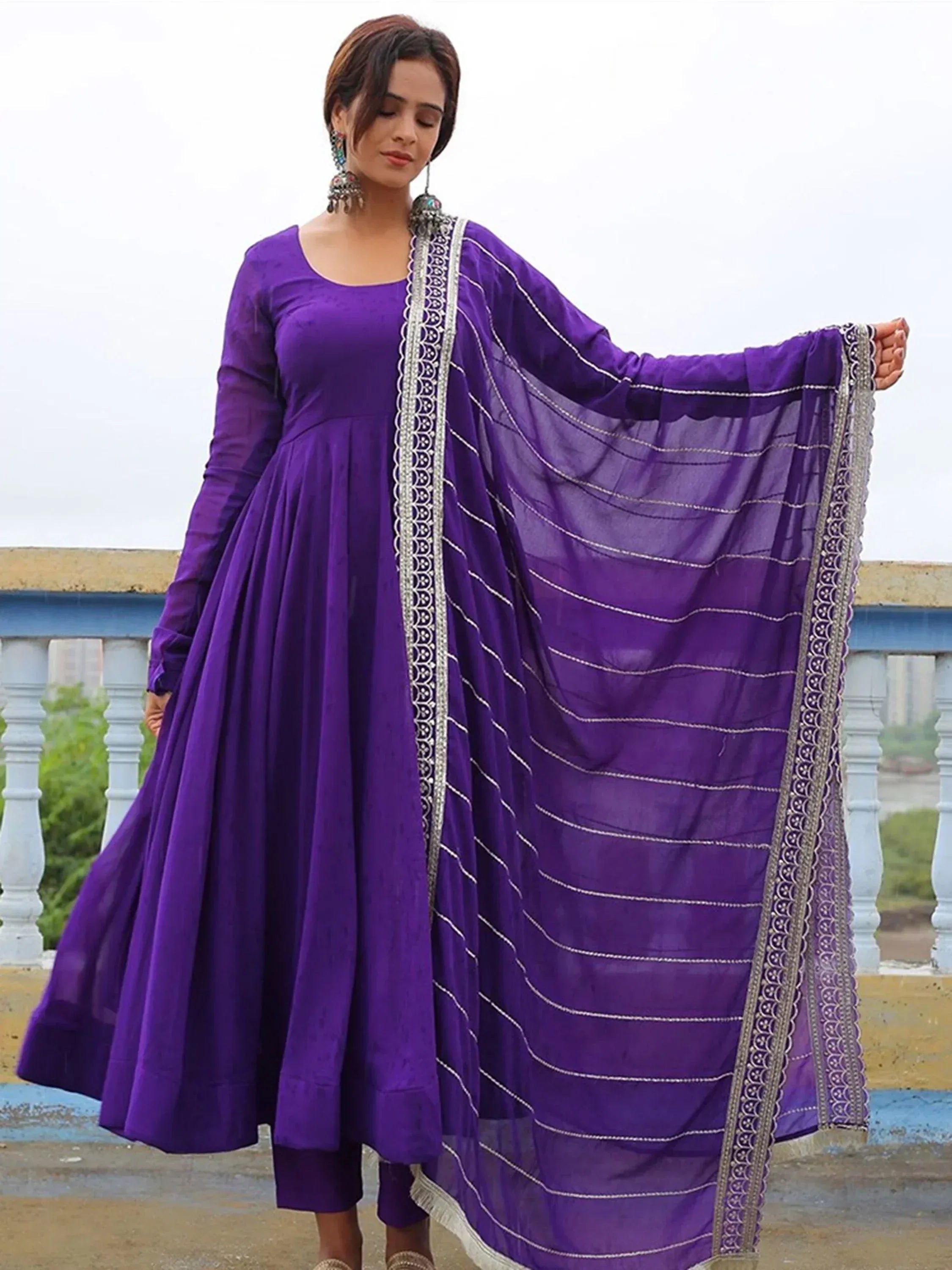 Purple ethnic anarkali suit with embroidered dupatta, perfect for Indian occasions and festive wear.