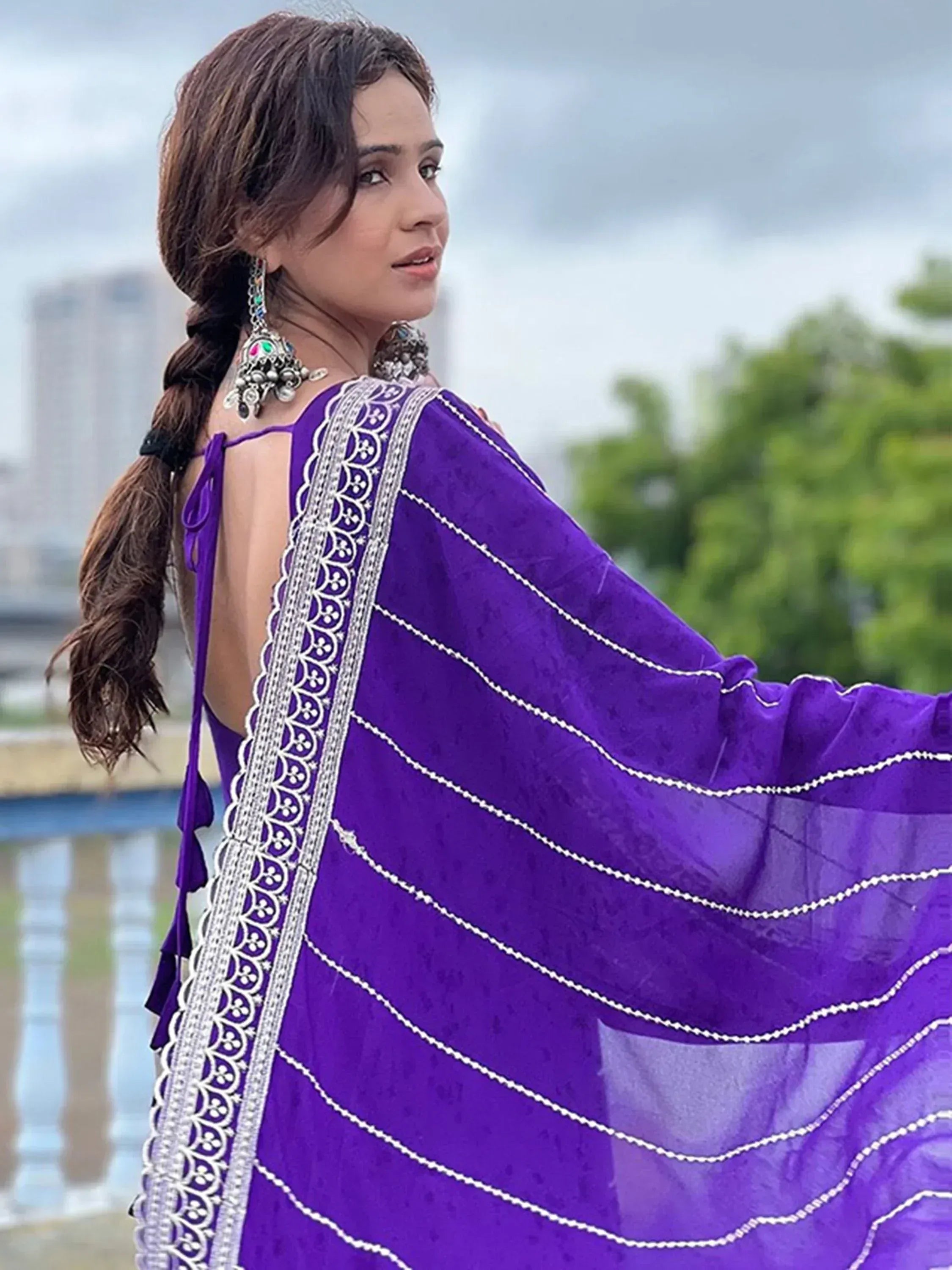 Purple ethnic gown with silver embroidery, perfect for Indian occasions and festive wear.