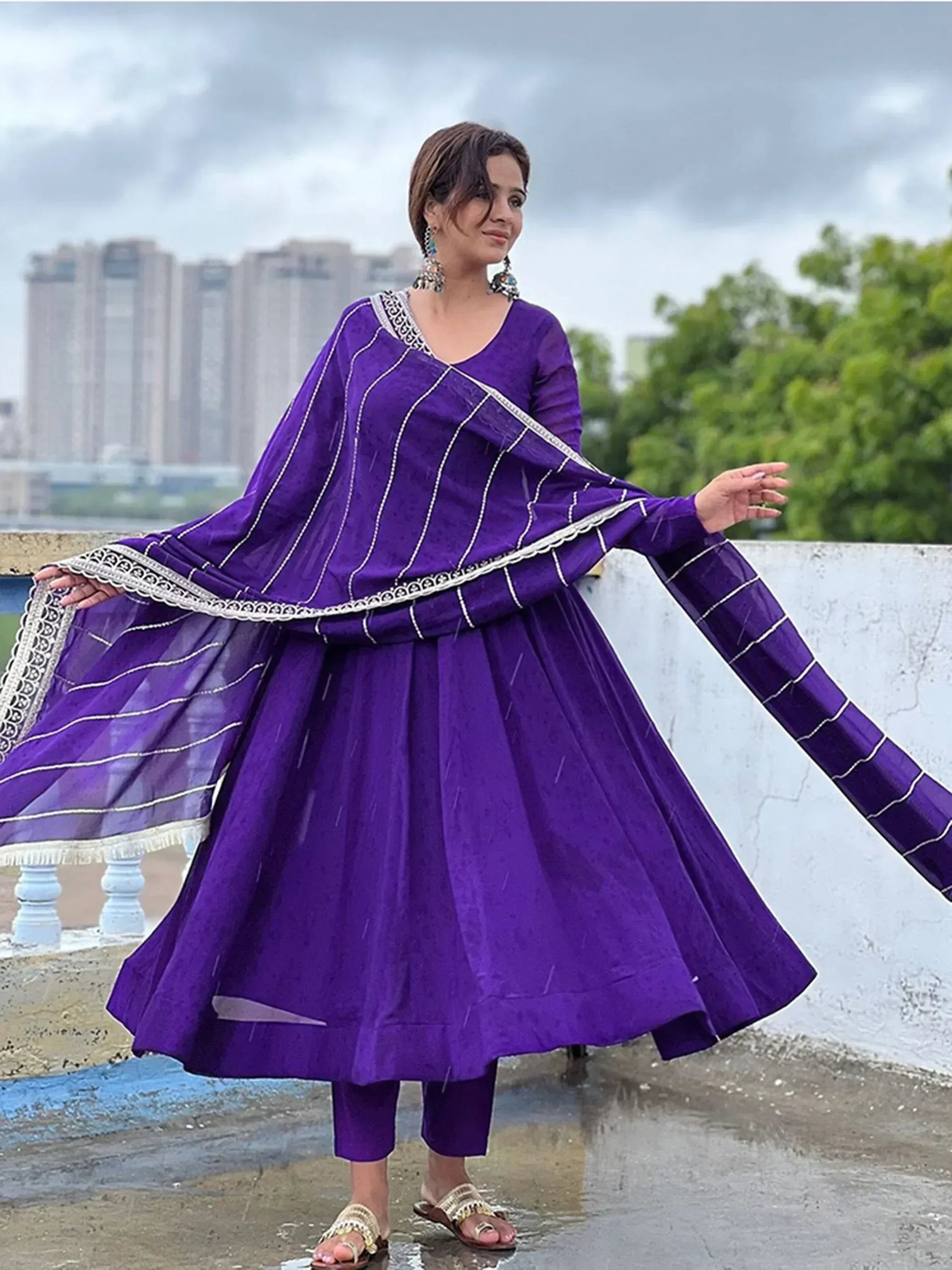 Purple ethnic anarkali suit with white embroidery, perfect for Indian occasions and festive wear.