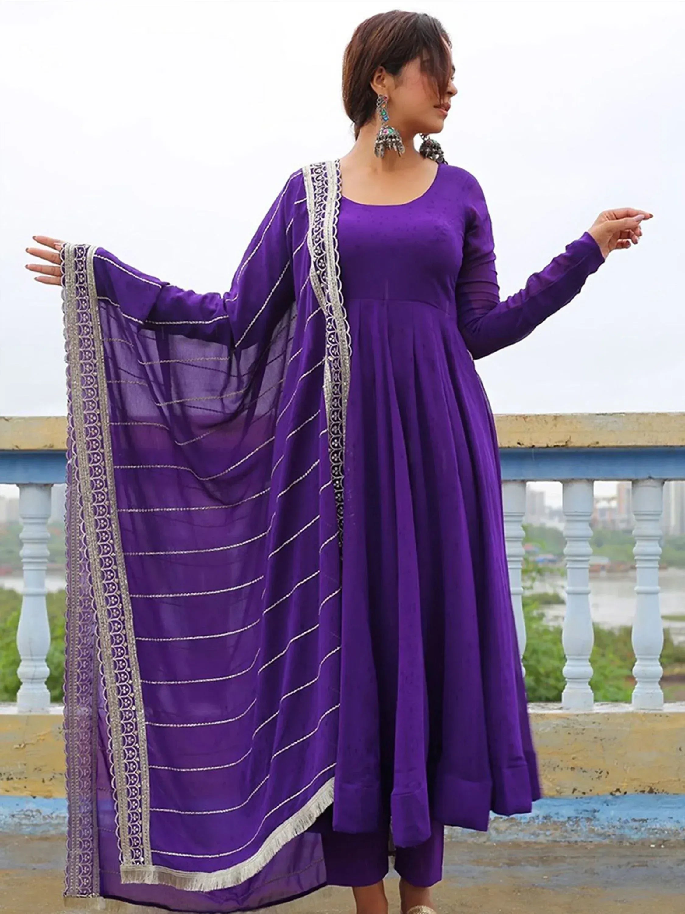Purple ethnic anarkali suit with embroidered dupatta, perfect for Indian occasions and festive wear.
