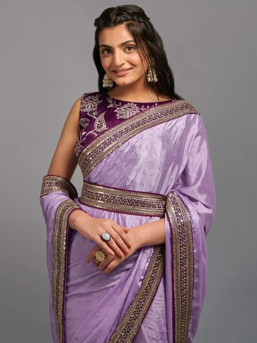 Elegant purple saree with intricate embroidery and golden borders, perfect for Indian ethnic wear