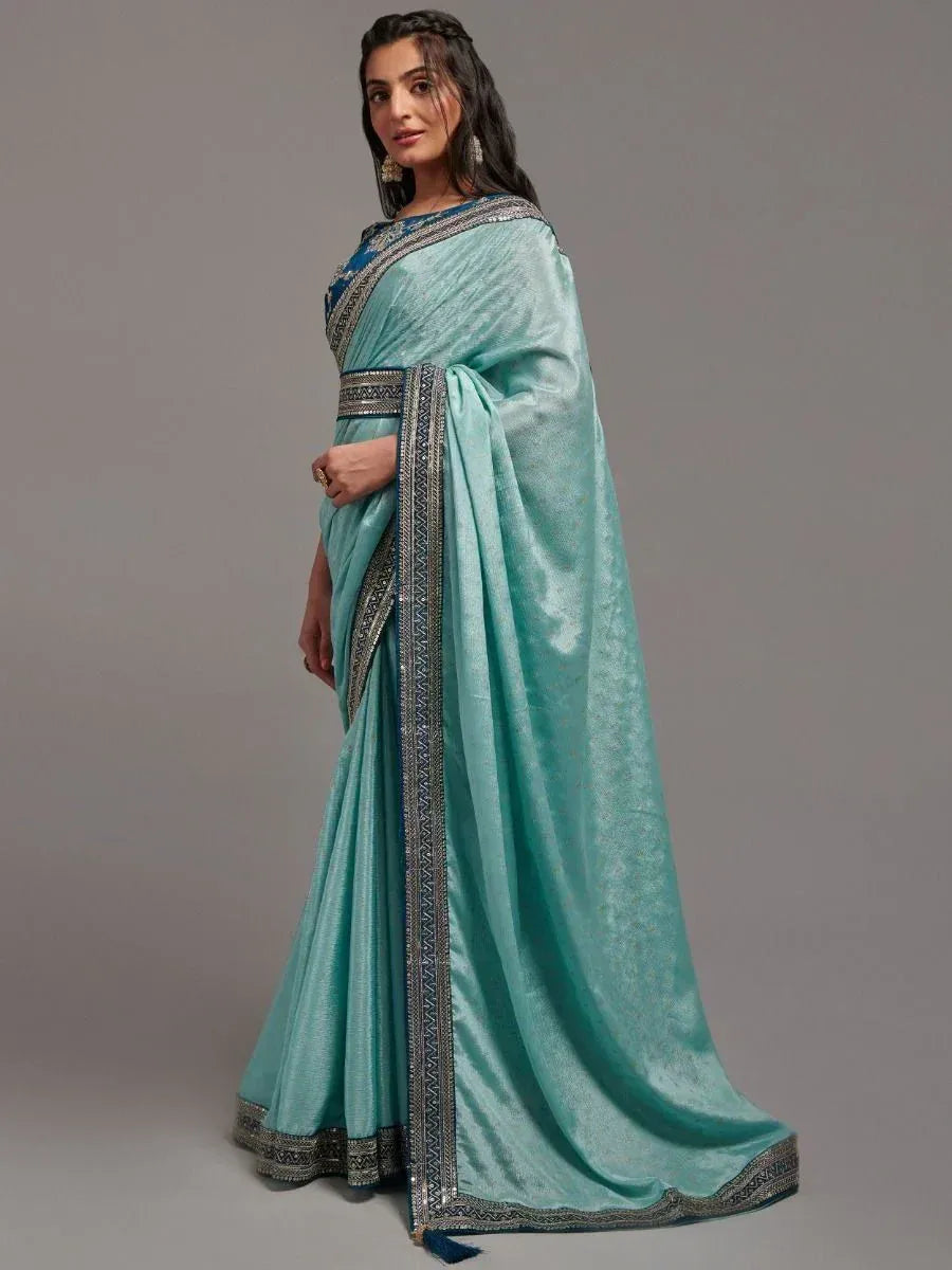 Elegant teal saree with silver zari border, perfect for Indian ethnic occasions