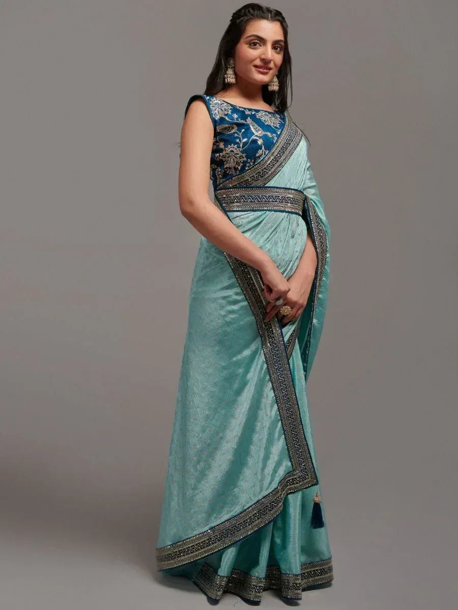 Elegant turquoise saree with intricate embroidery and designer blouse for Indian ethnic wear