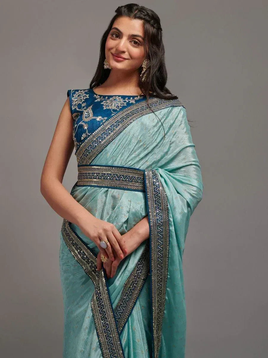 Elegant teal saree with blue embroidered blouse, perfect for Indian ethnic wear occasions