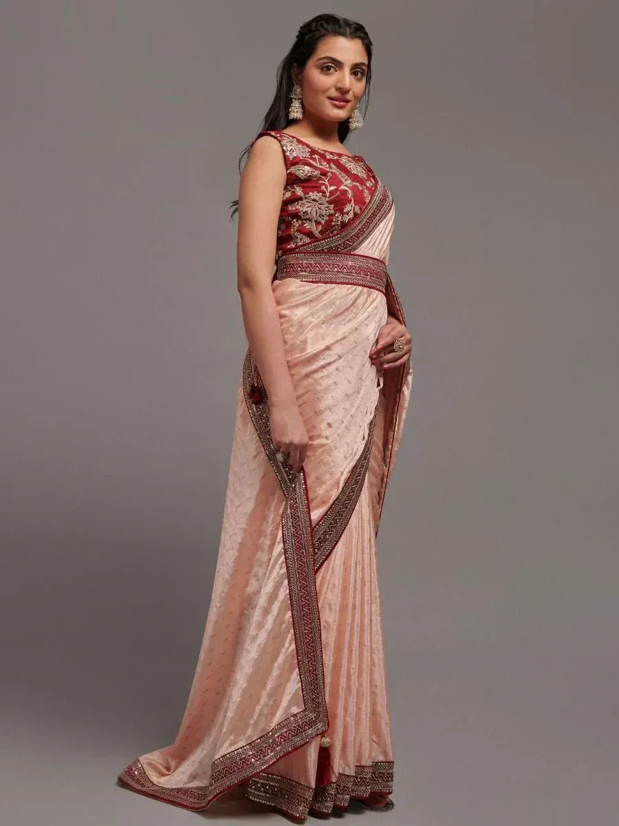 Elegant peach saree with maroon embroidered blouse and border, perfect for Indian ethnic occasions