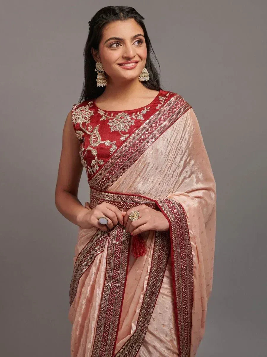 Elegant pink saree with red embroidered blouse, perfect for Indian ethnic occasions and festive wear.