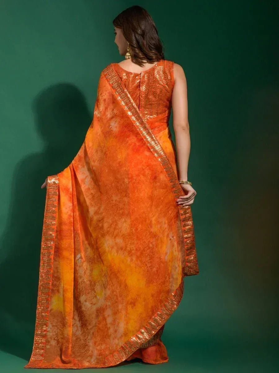 Orange tie-dye saree with gold border, back view, ethnic wear for women