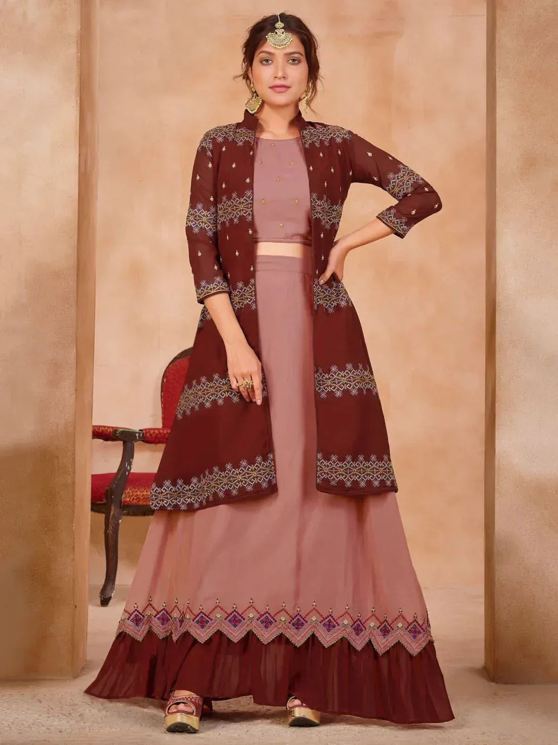Maroon embroidered ethnic sharara set with matching jacket and dupatta, perfect for Indian occasions
