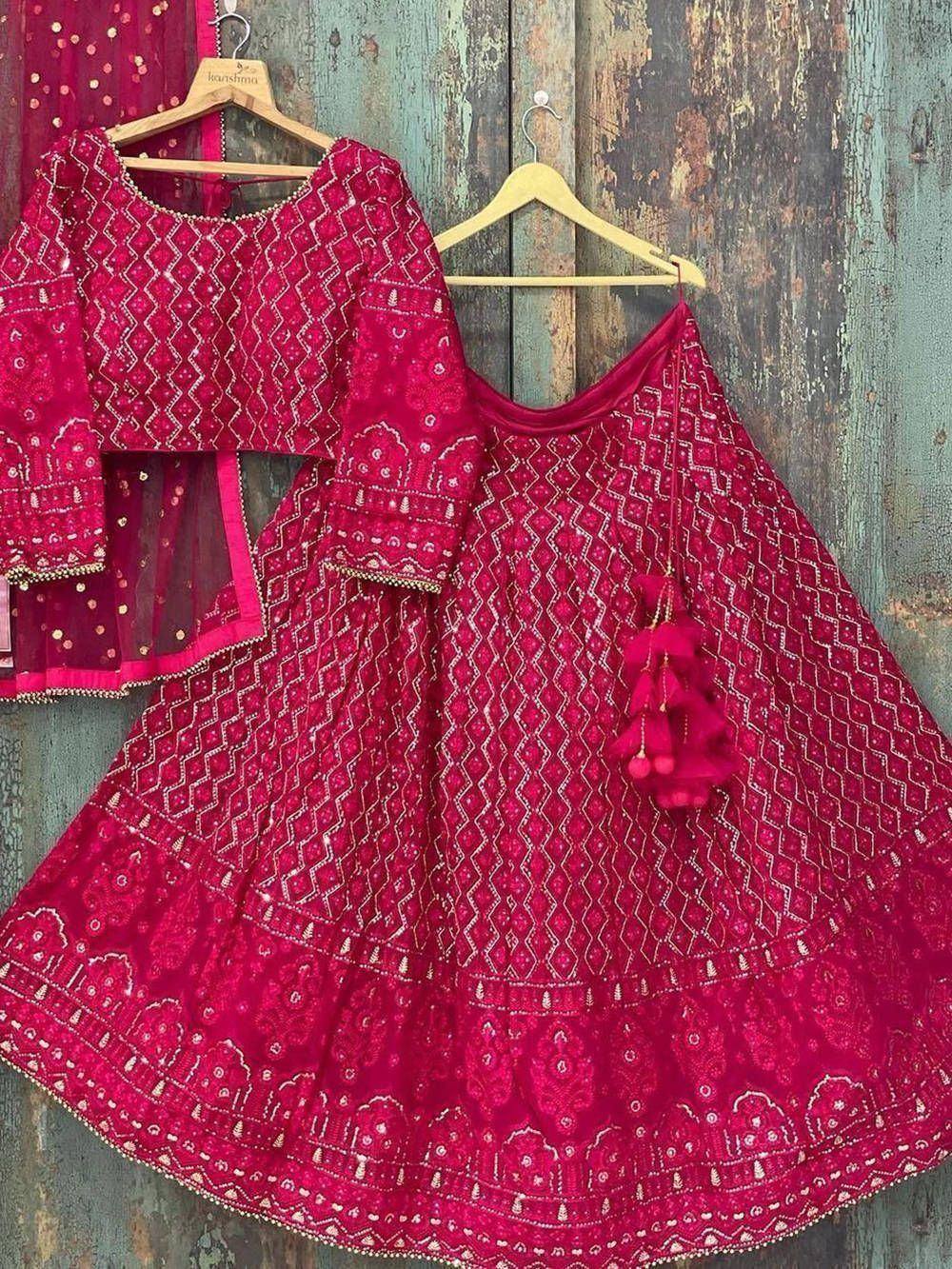 Fuchsia embroidered lehenga choli with geometric patterns and tassel details, perfect for Indian ethnic wear occasions