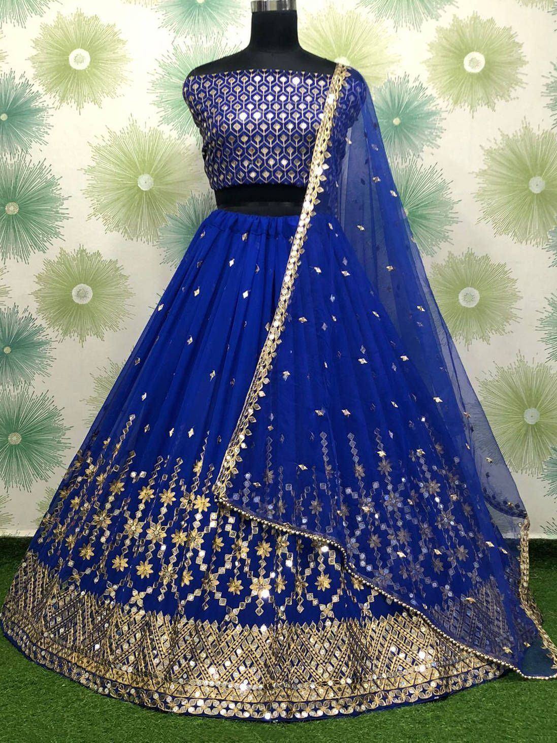 Royal blue lehenga choli with gold mirror work and net dupatta, perfect for Indian ethnic occasions