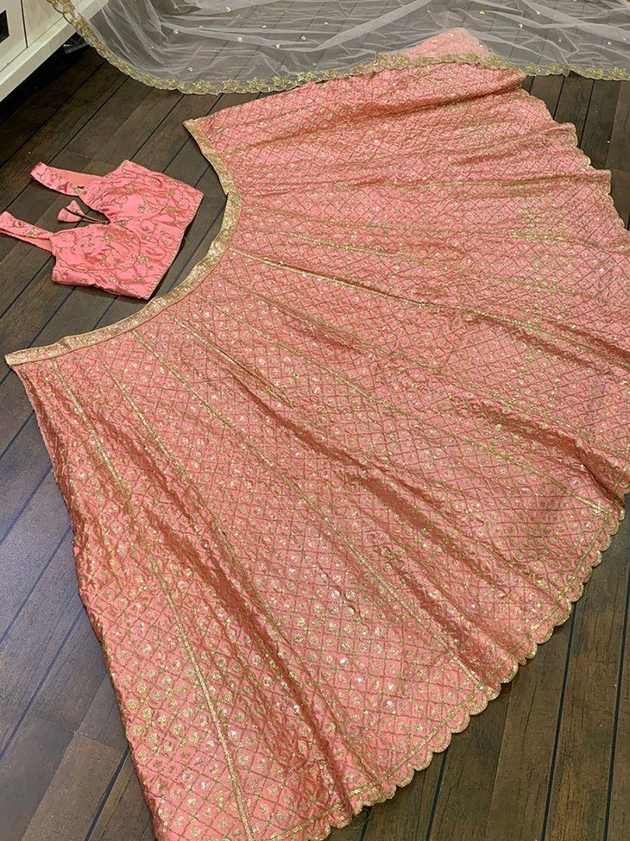 Pink designer lehenga choli with gold embroidery, scalloped hem, and matching dupatta for ethnic wear