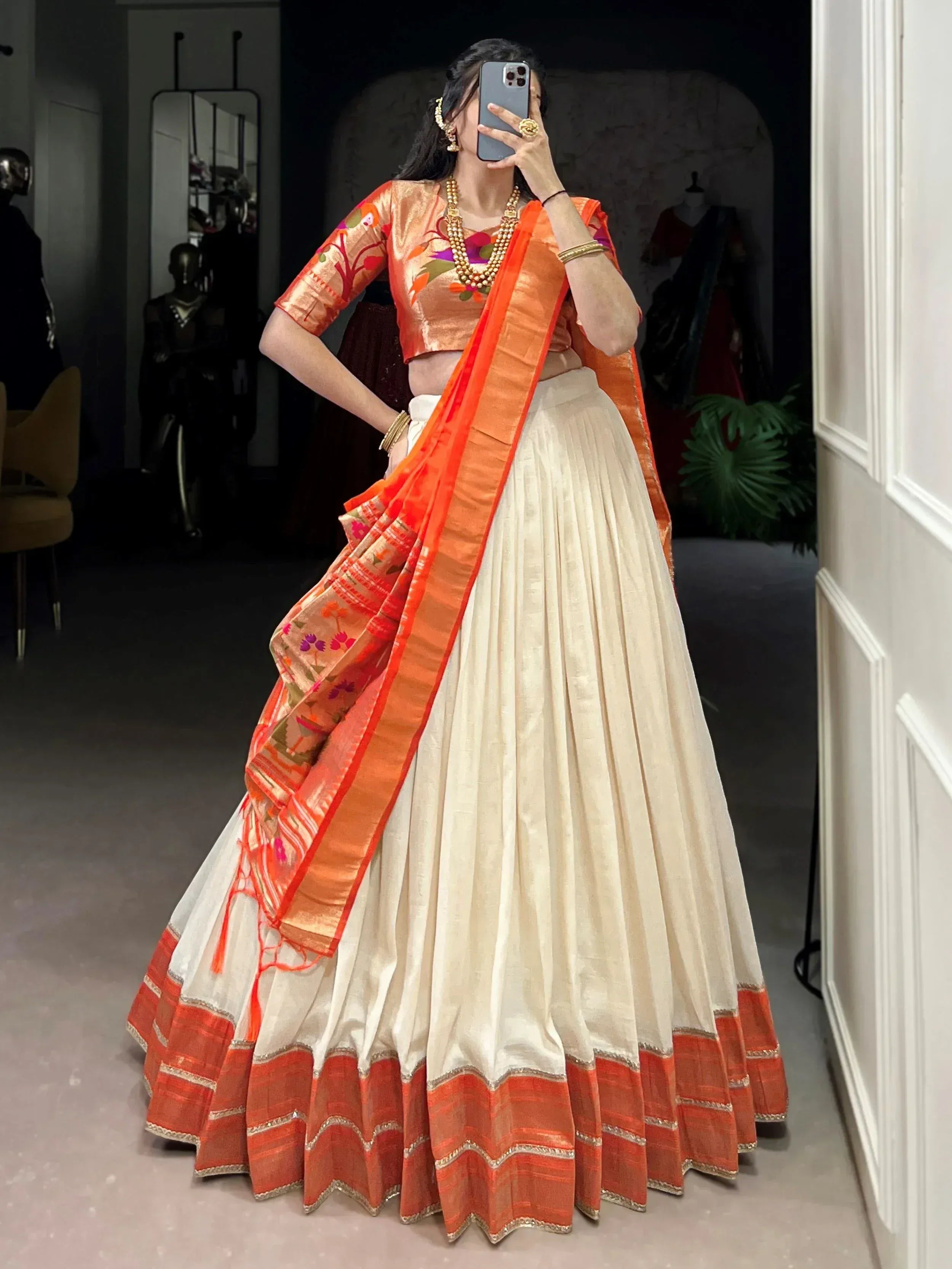 Orange floral blouse with cream pleated lehenga and matching dupatta, Indian ethnic wear