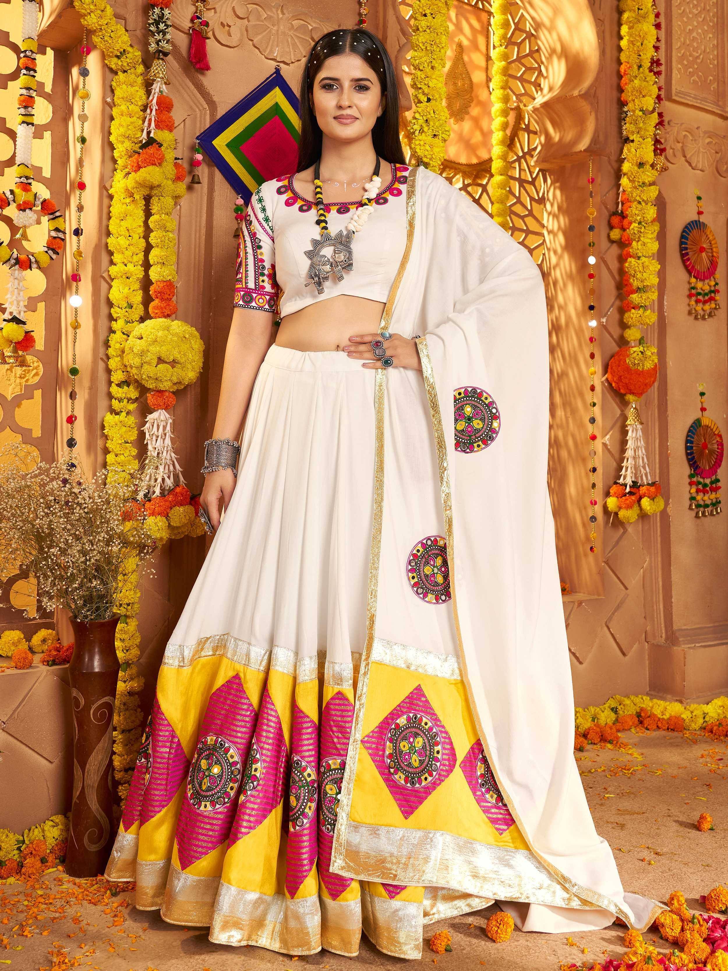 White ethnic lehenga choli with colorful embroidery, perfect for Indian festivals and celebrations