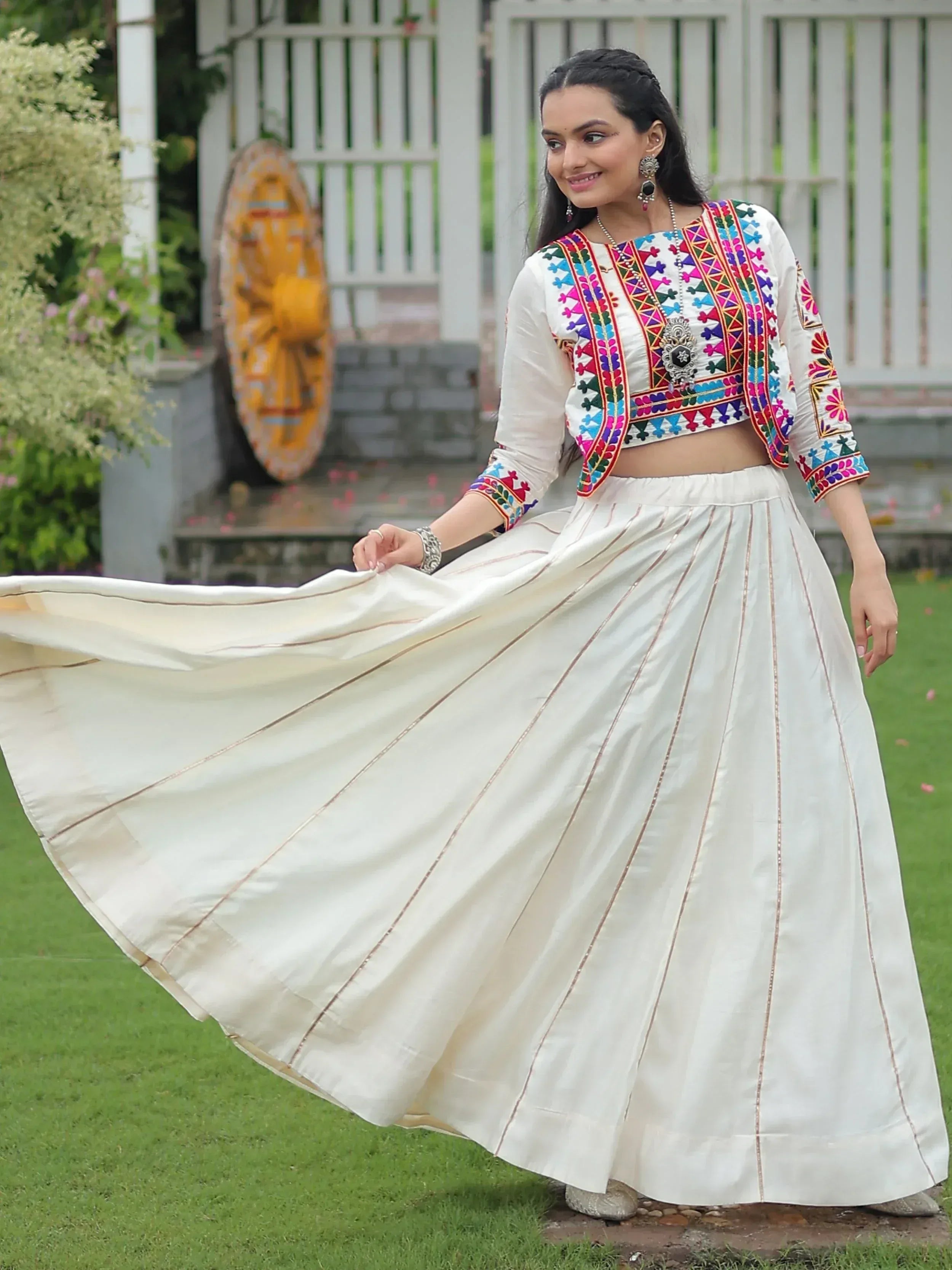 White embroidered crop top with colorful mirror work paired with pleated skirt, Indian ethnic wear