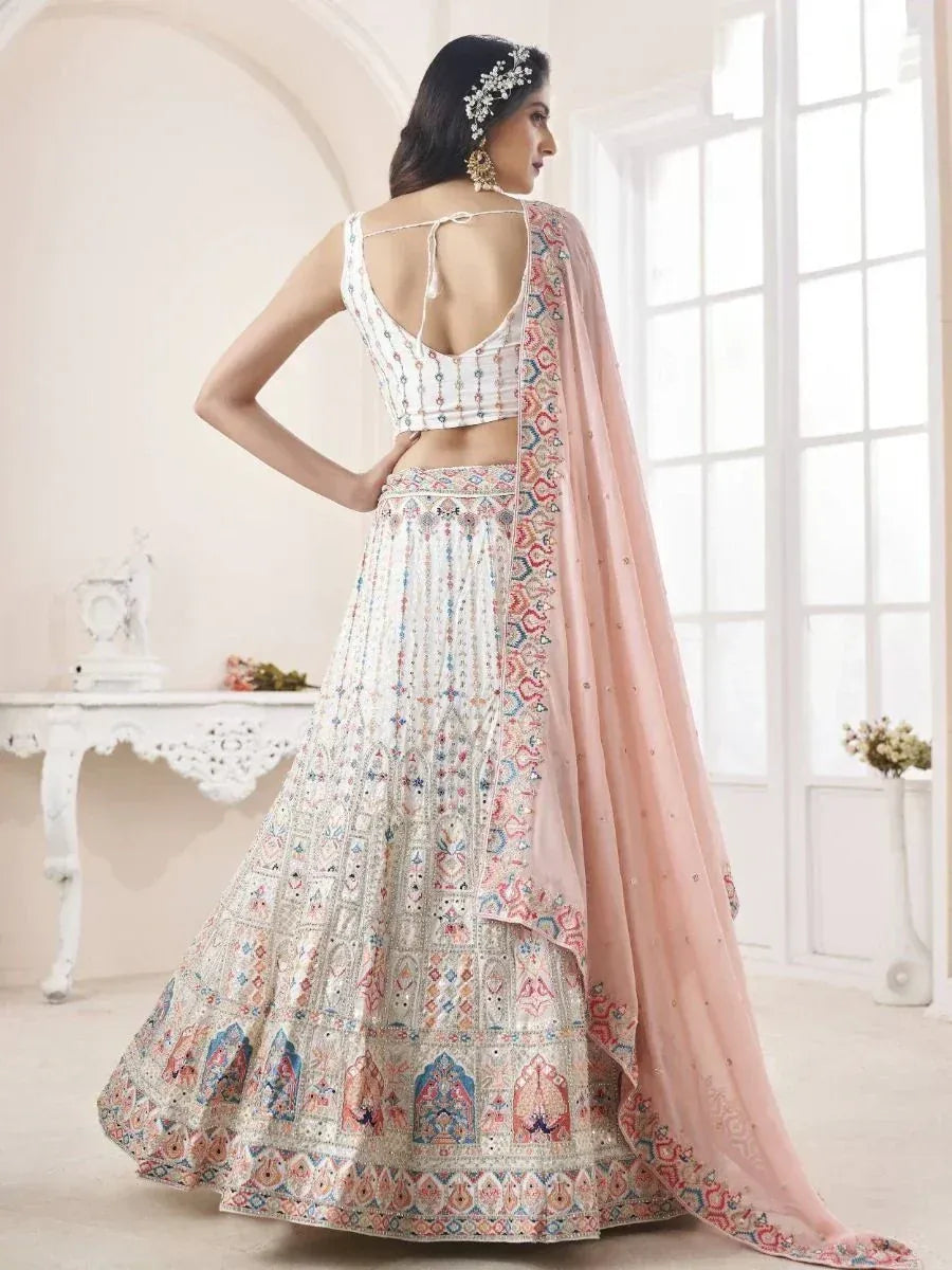 Elegant white lehenga choli with colorful embroidery and pink dupatta, perfect for Indian weddings and festive occasions.