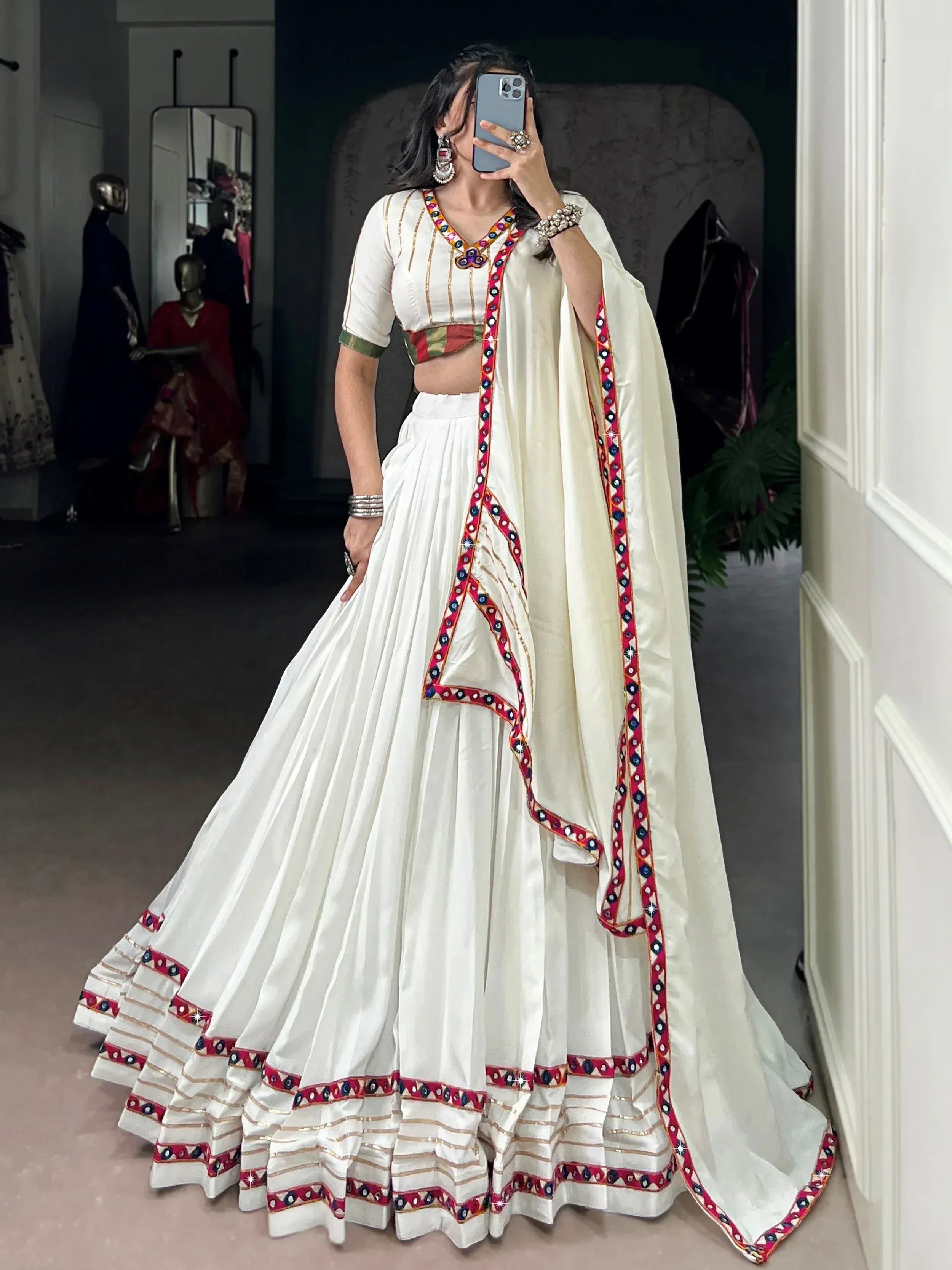 White embroidered lehenga choli with mirror work and dupatta, Indian ethnic wear for women